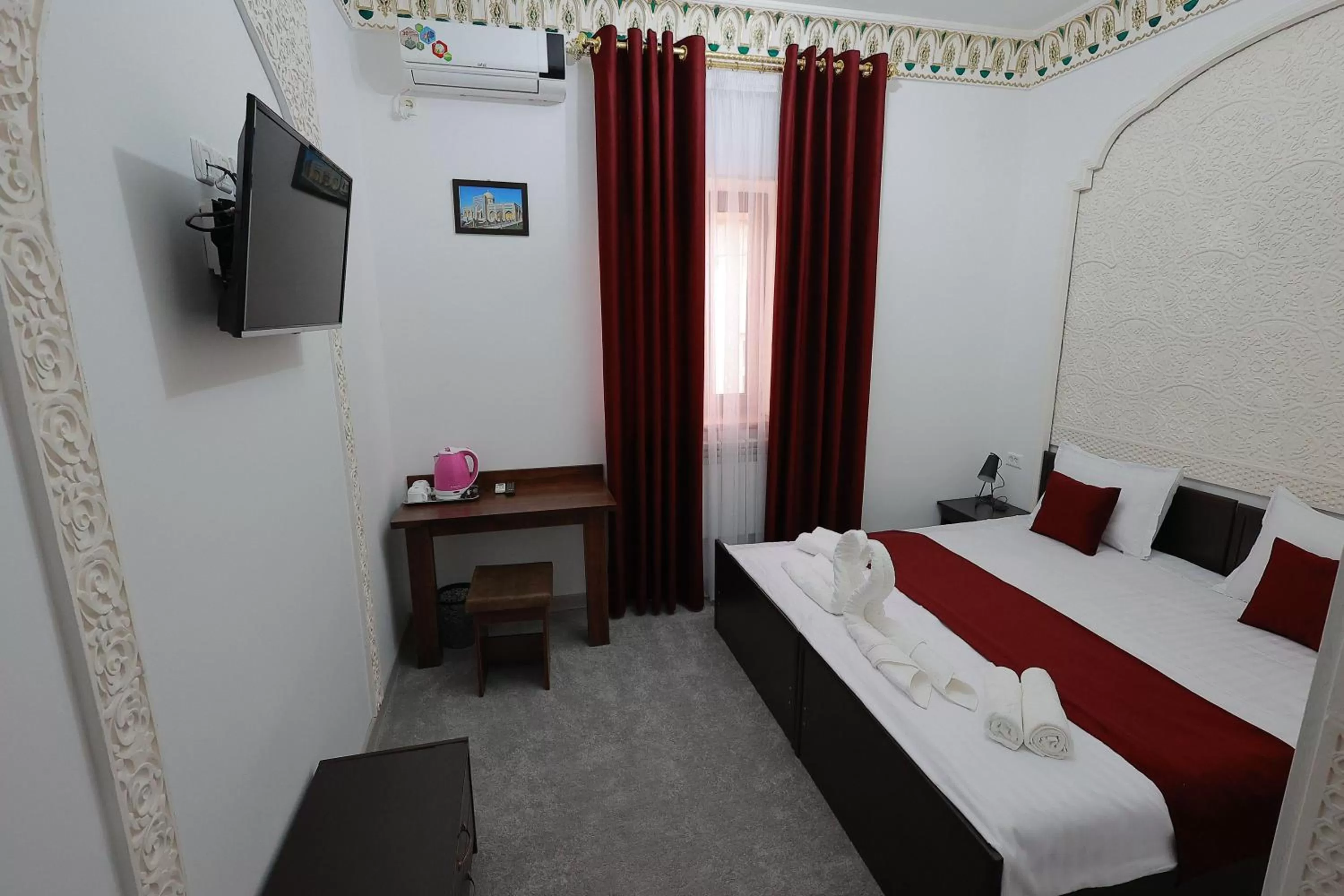 Communal lounge/ TV room, Bed in Jahangir Boutique Bukhara