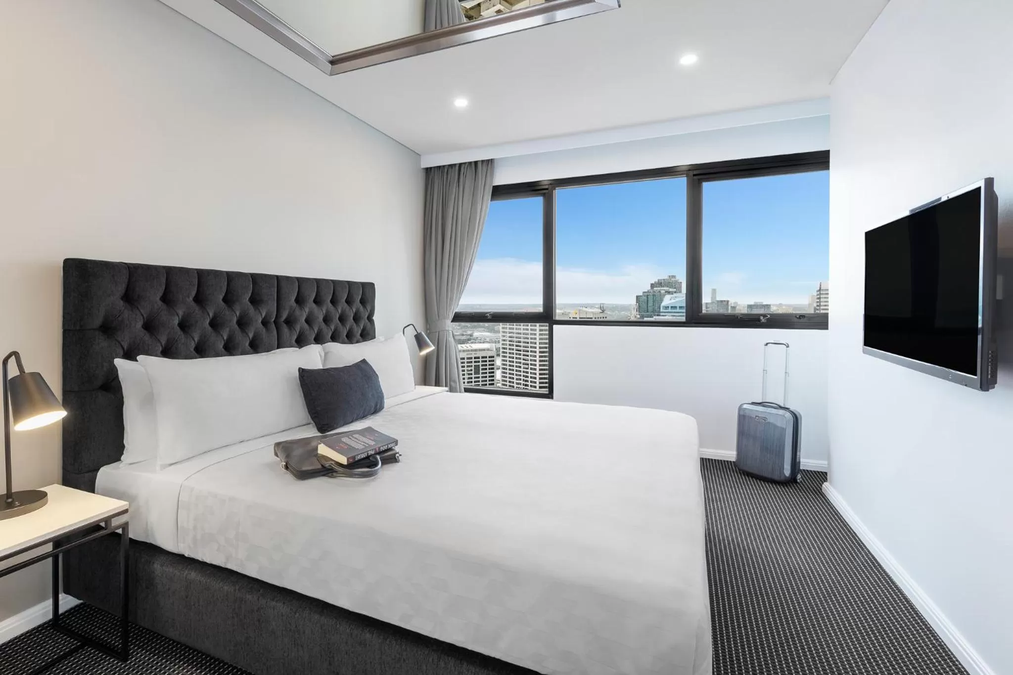 Bed in Meriton Suites Kent Street, Sydney