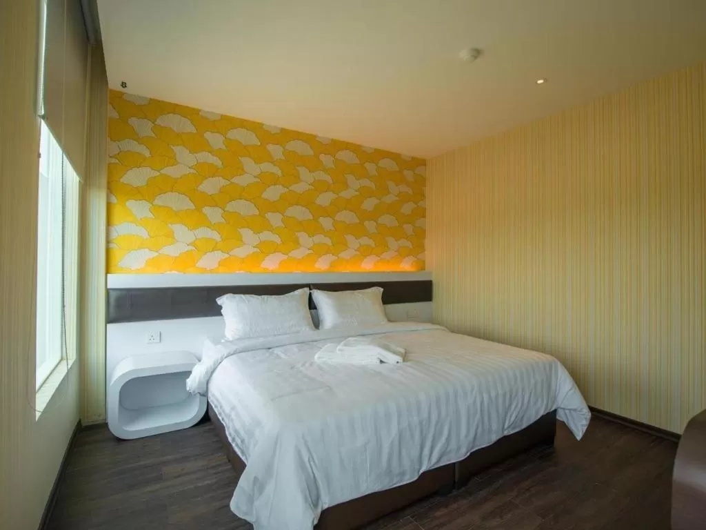 Bed in Riverfront Boutique Hotel