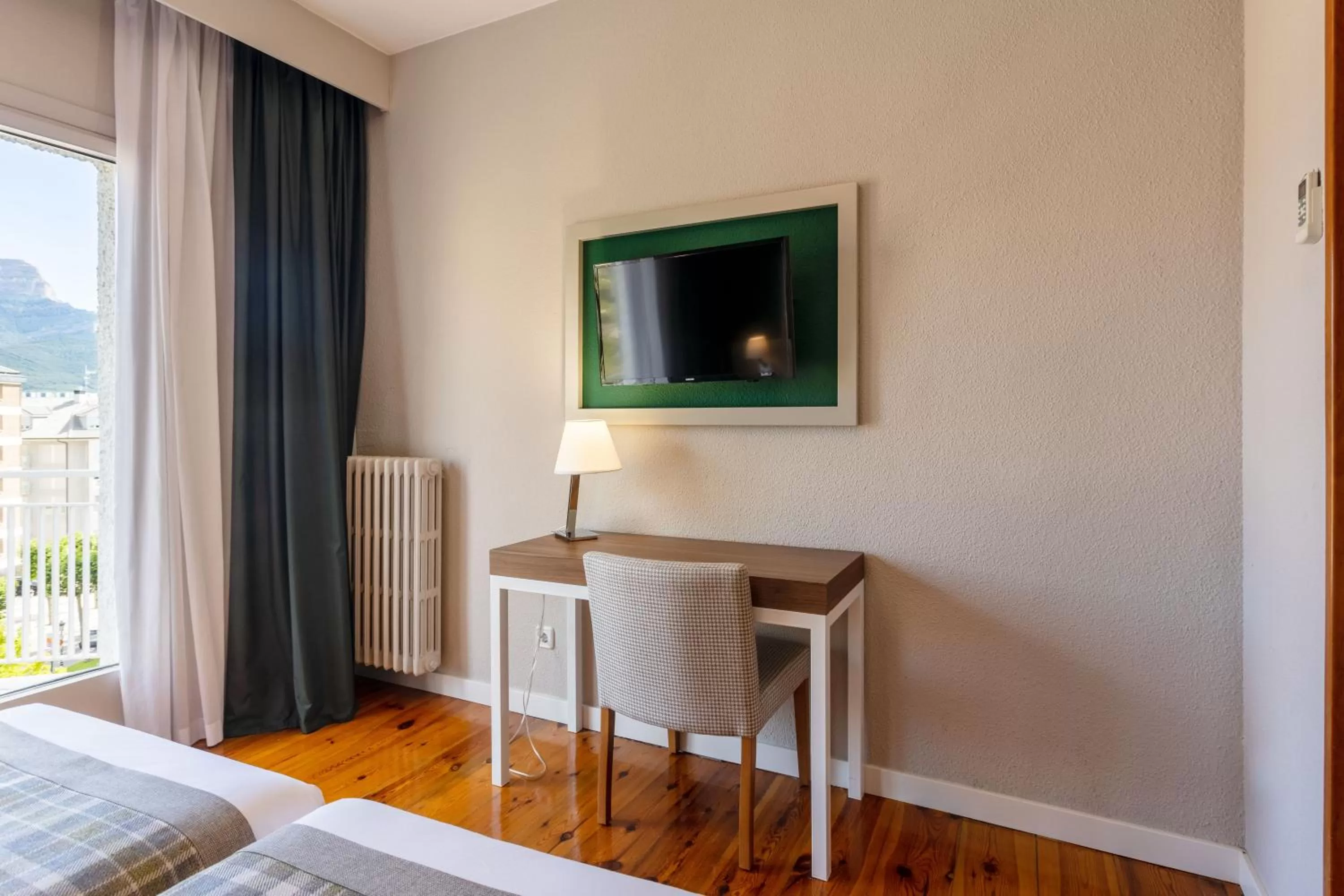 Communal lounge/ TV room, Bed in Gran Hotel de Jaca