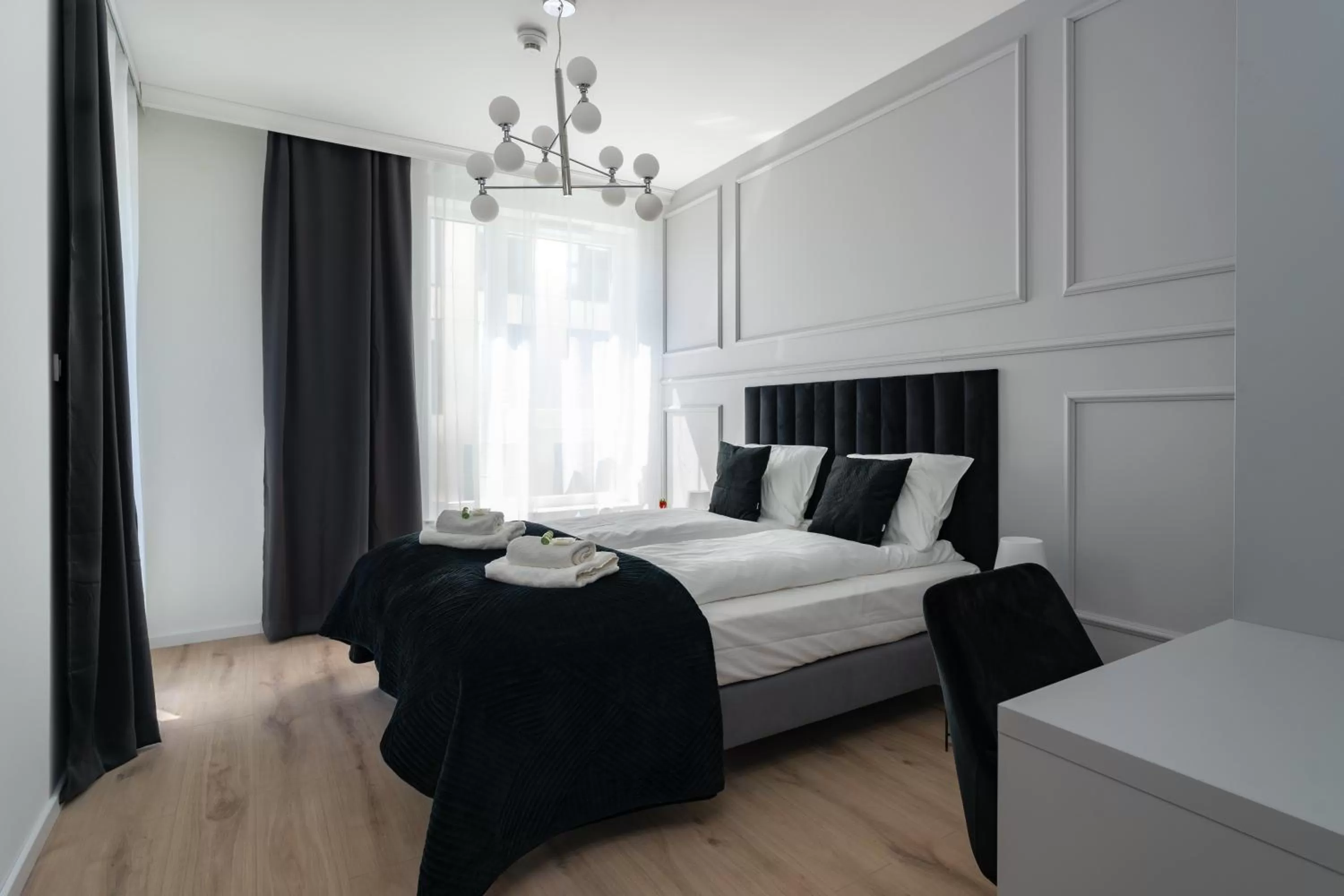 Bed in Symphony Modern Tower Apartamenty