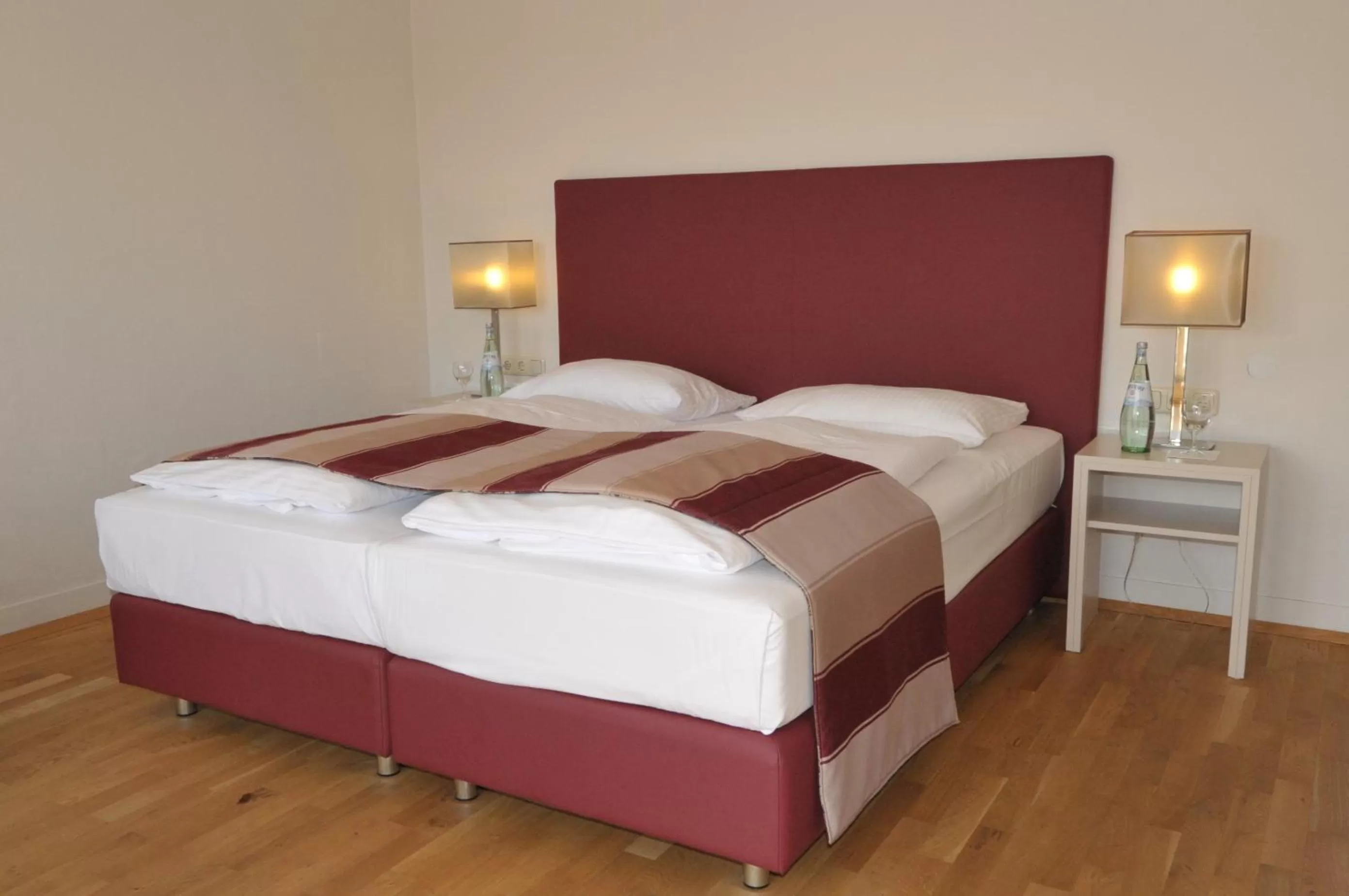 Bed in Ambassador Parkhotel