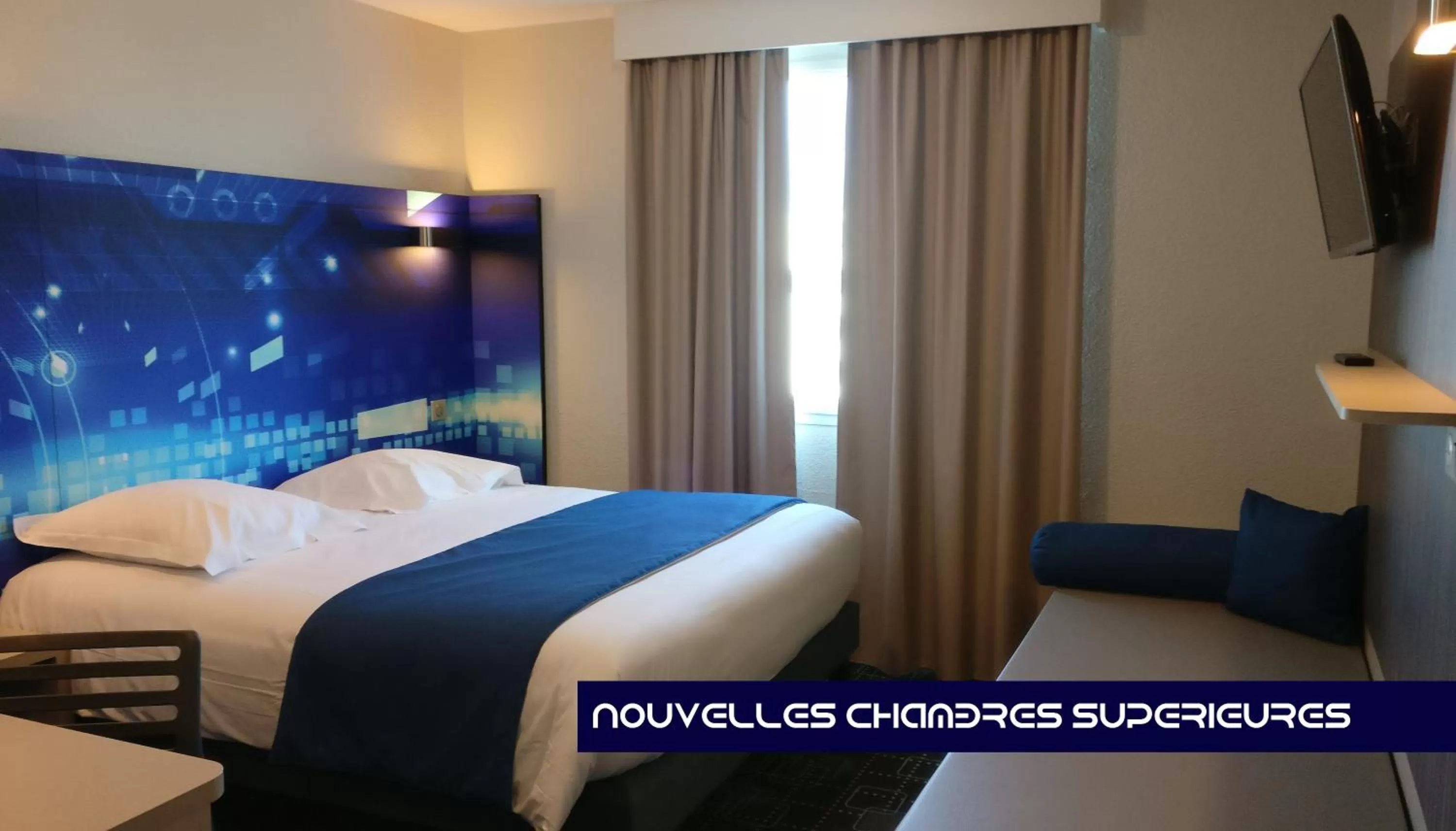 Photo of the whole room, Bed in Kyriad Poitiers Jules Verne Site du Futuroscope