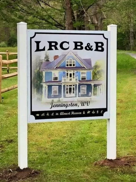 Property logo or sign in Laurel River Club Bed & Breakfast or LRCBNB