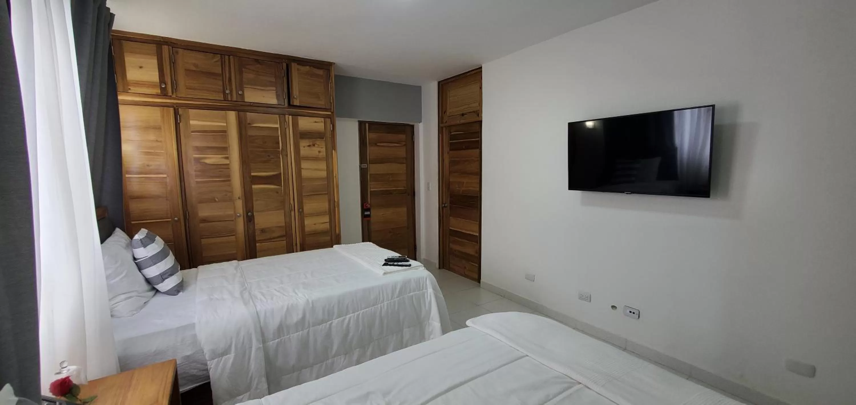 Bed in Boca Grande Hotel Suites