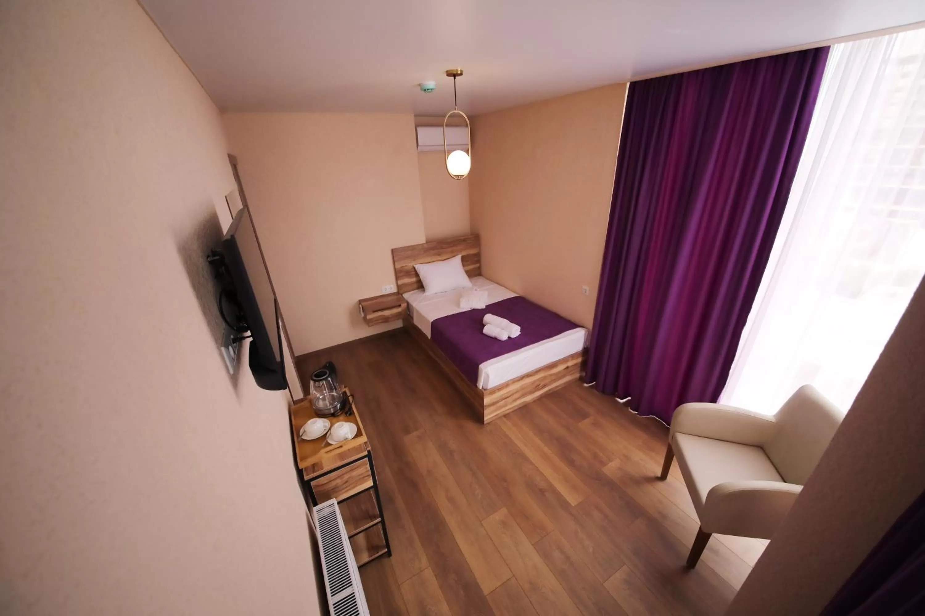 Communal lounge/ TV room, TV/Entertainment Center in Bessarion Boutique Hotel