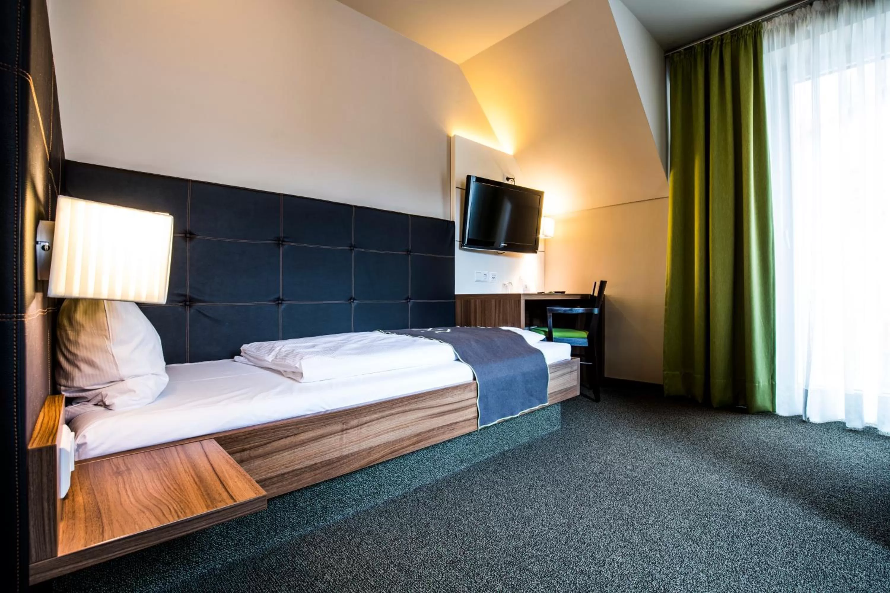 Photo of the whole room, Bed in RiKu HOTEL Weißenhorn