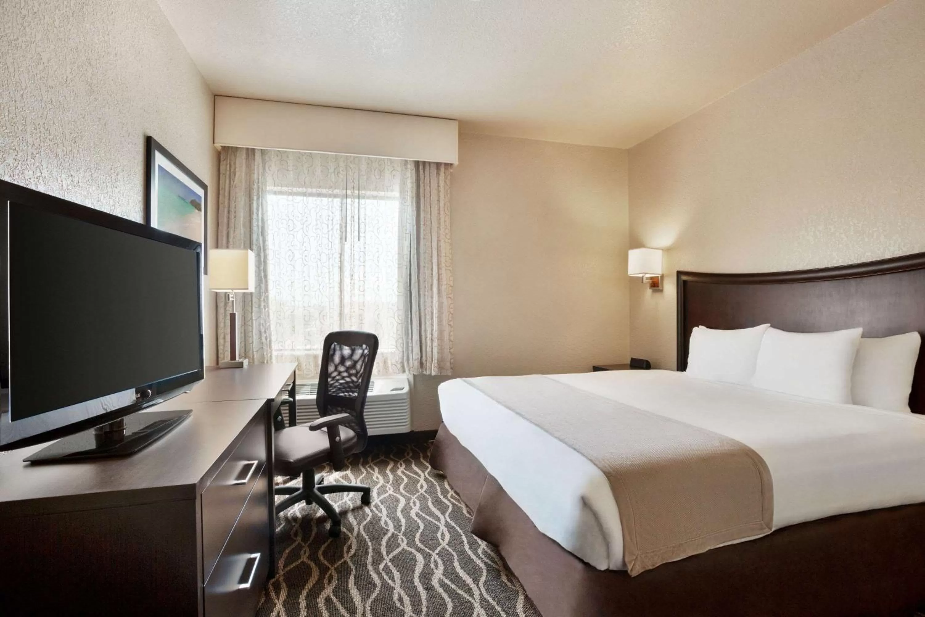 Photo of the whole room, Bed in Baymont by Wyndham Clute Lake Jackson