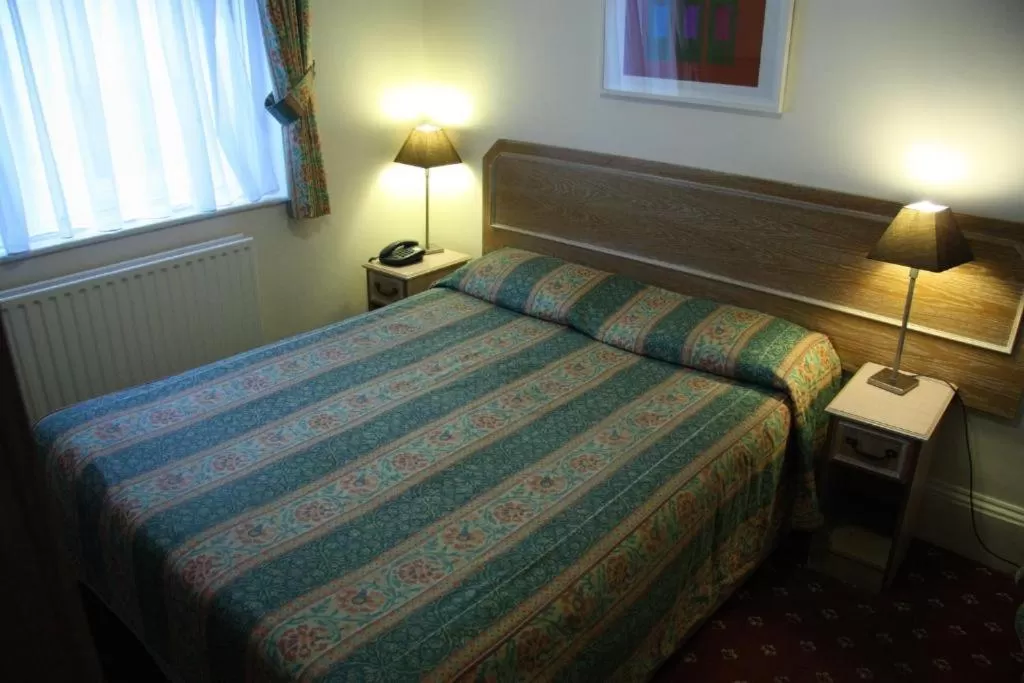 Bed in KingswayPark Hotel at Park Avenue