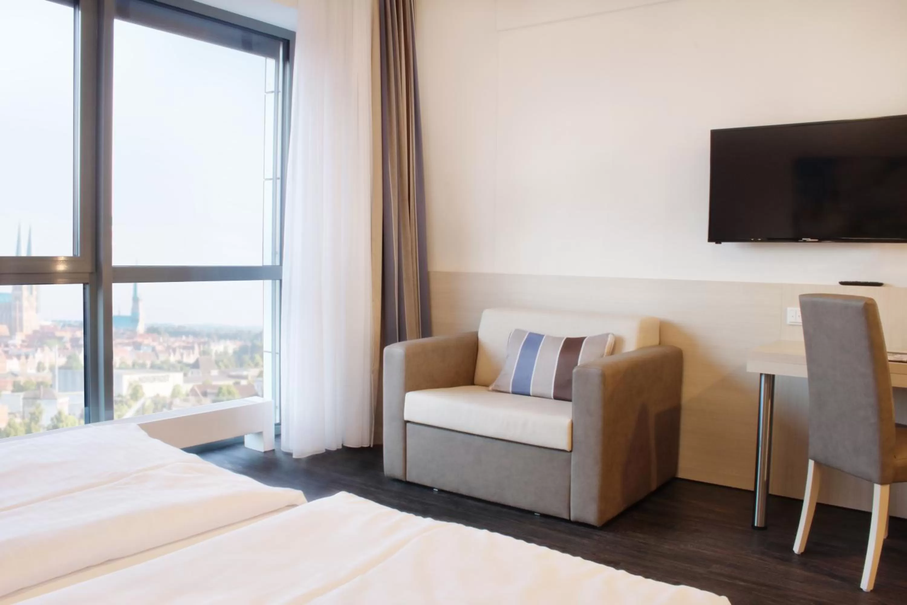 Seating area, Bed in Viva Hotel Lübeck