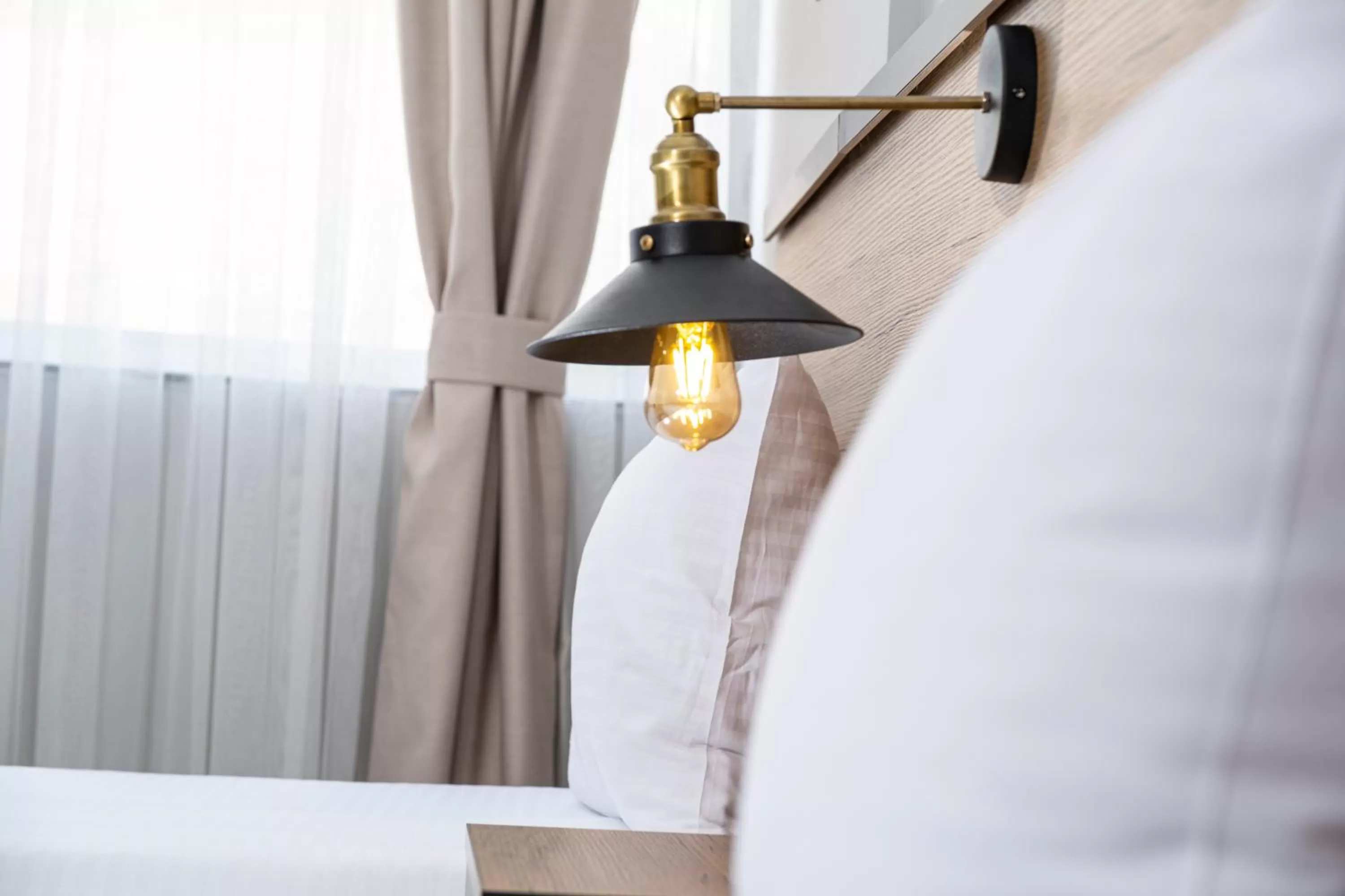 Bed in Comfort Center Suit Hotel