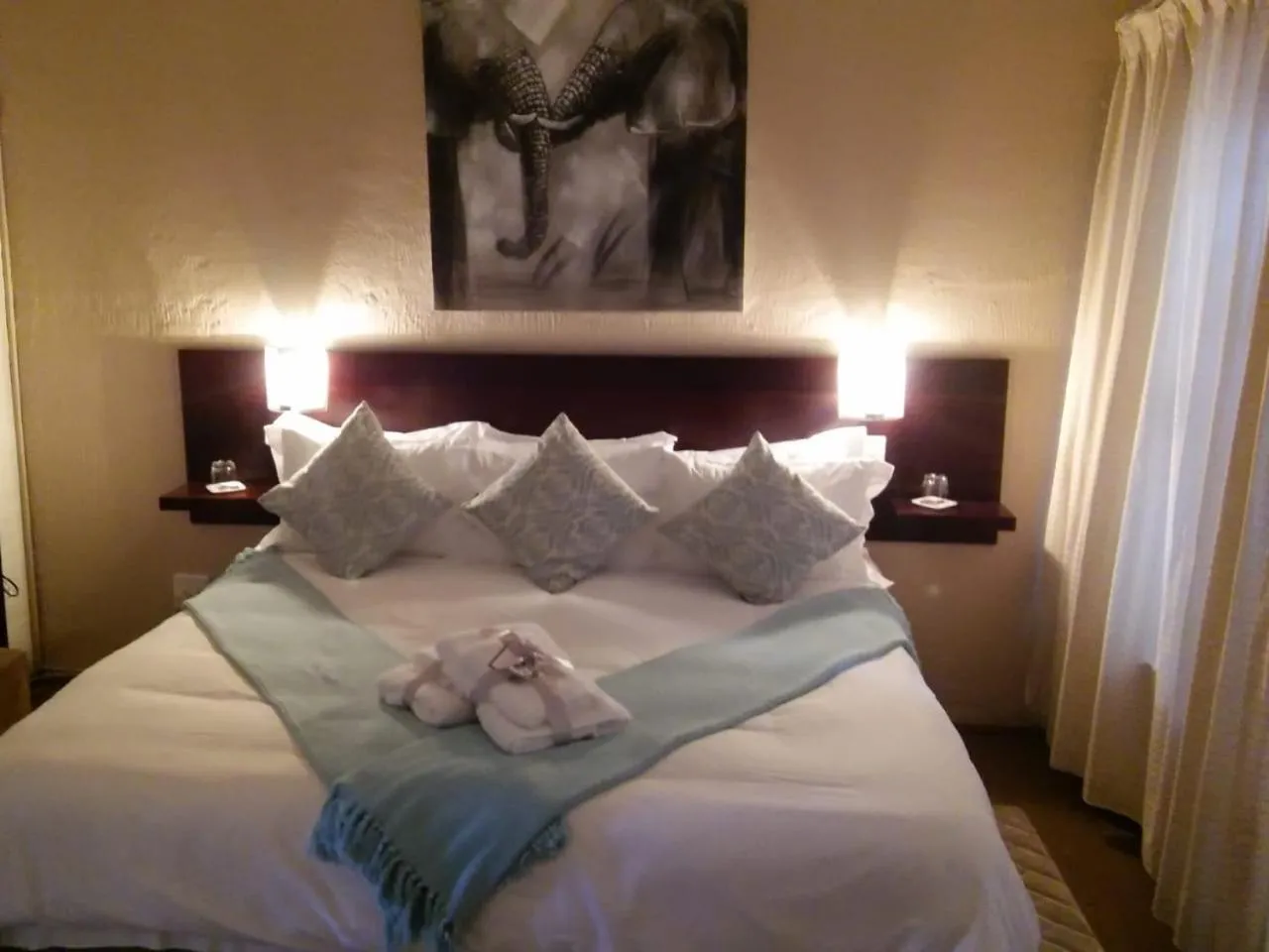 Bed in Point B Guest House -Sustainable Solar Energy