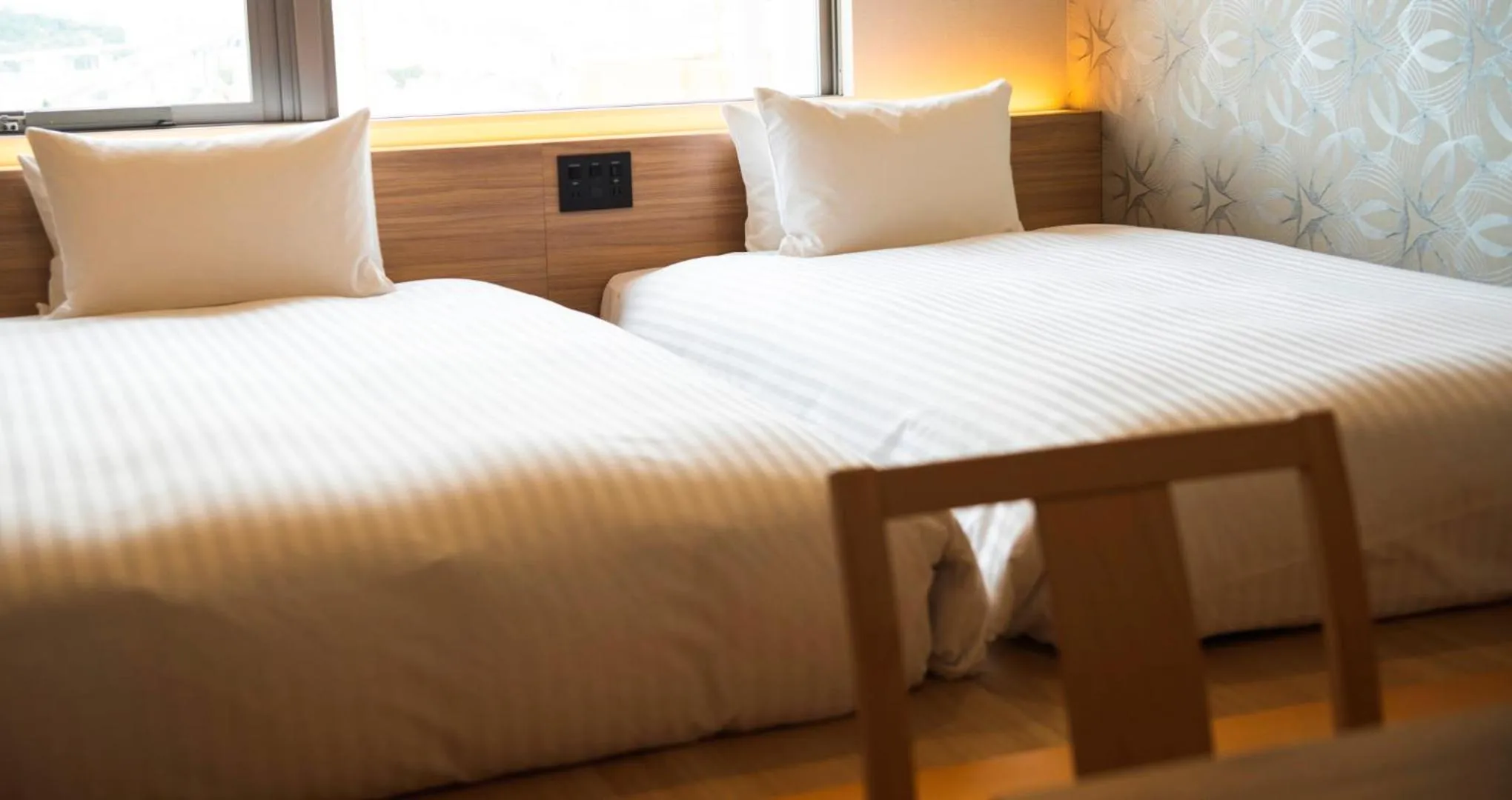 Bed in HOTEL SANSUI NAHA Ryukyu Onsen Naminoue-No-Yu