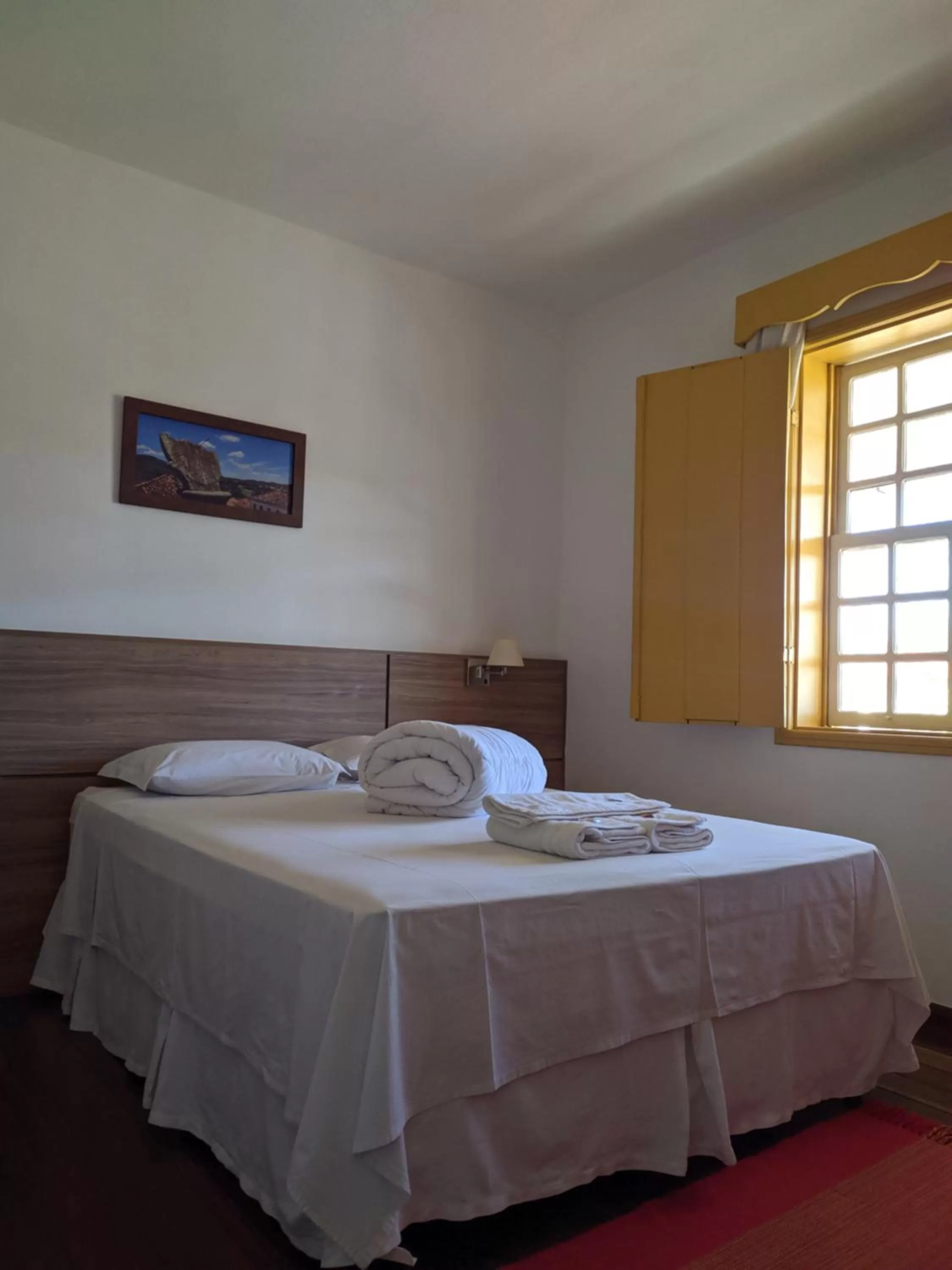 Bed in Pousada o Amanhecer