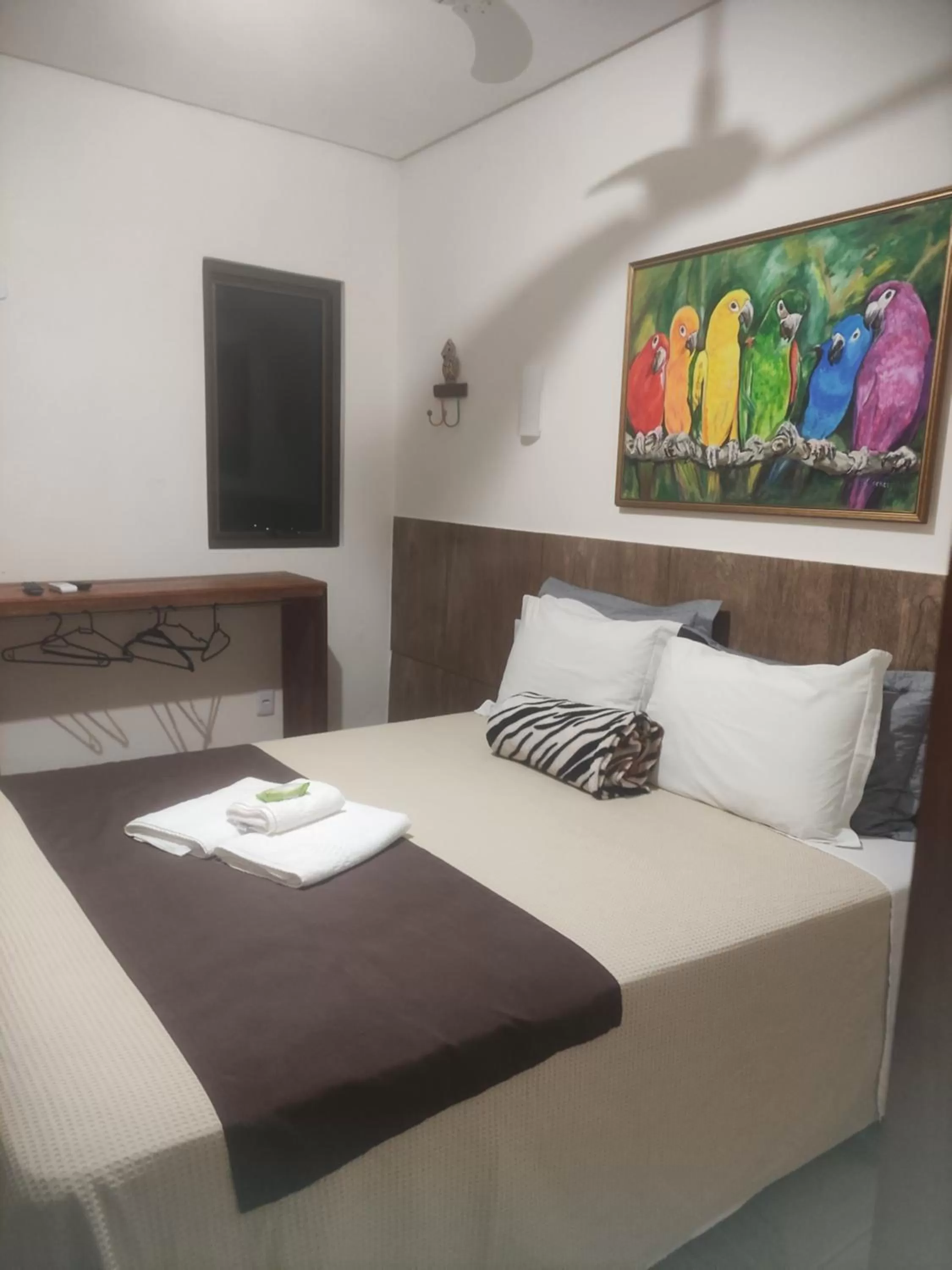 Bed in Pousada da Gi Suítes e Turismo