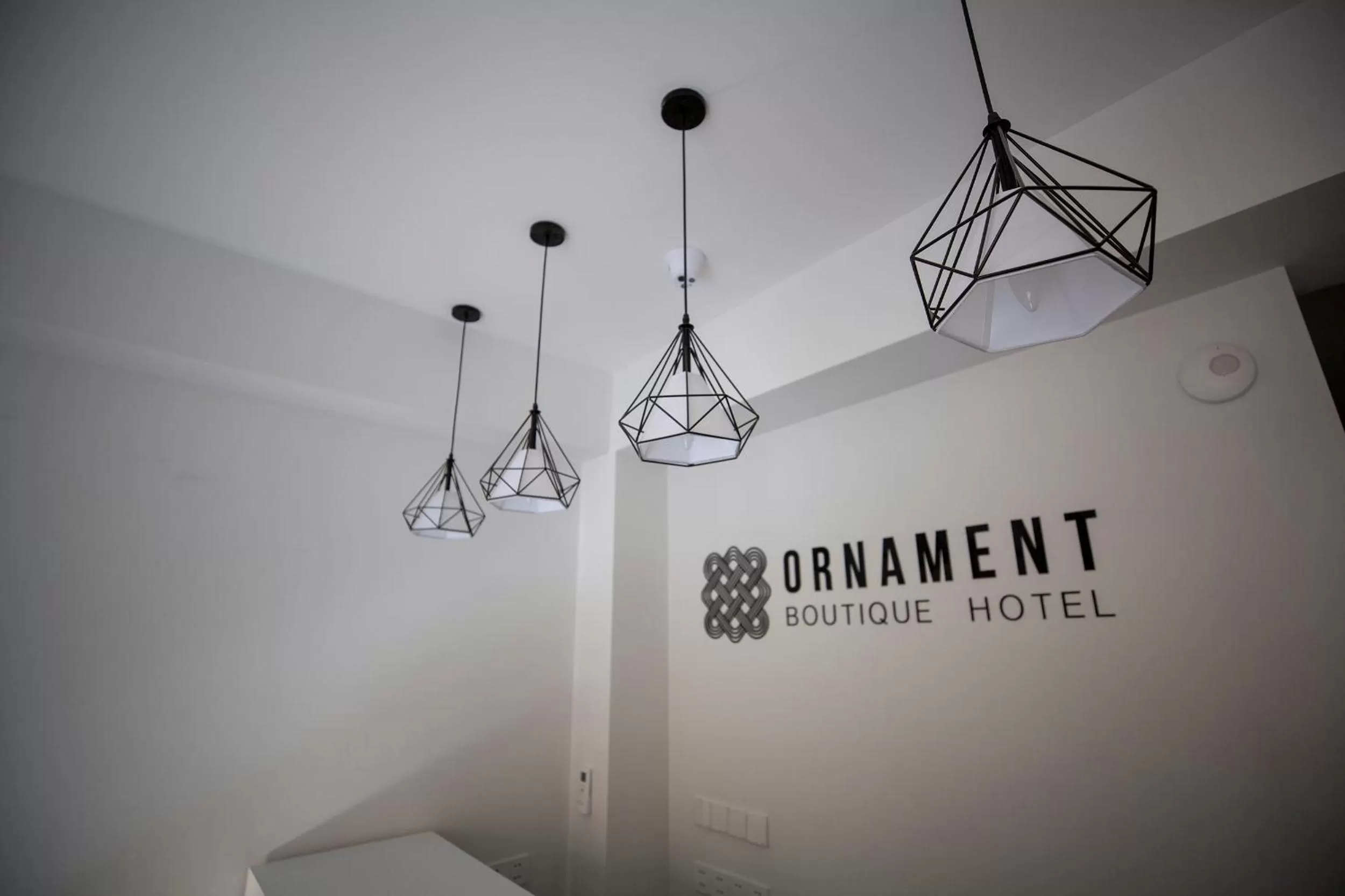 Property logo or sign in Ornament Boutique Hotel