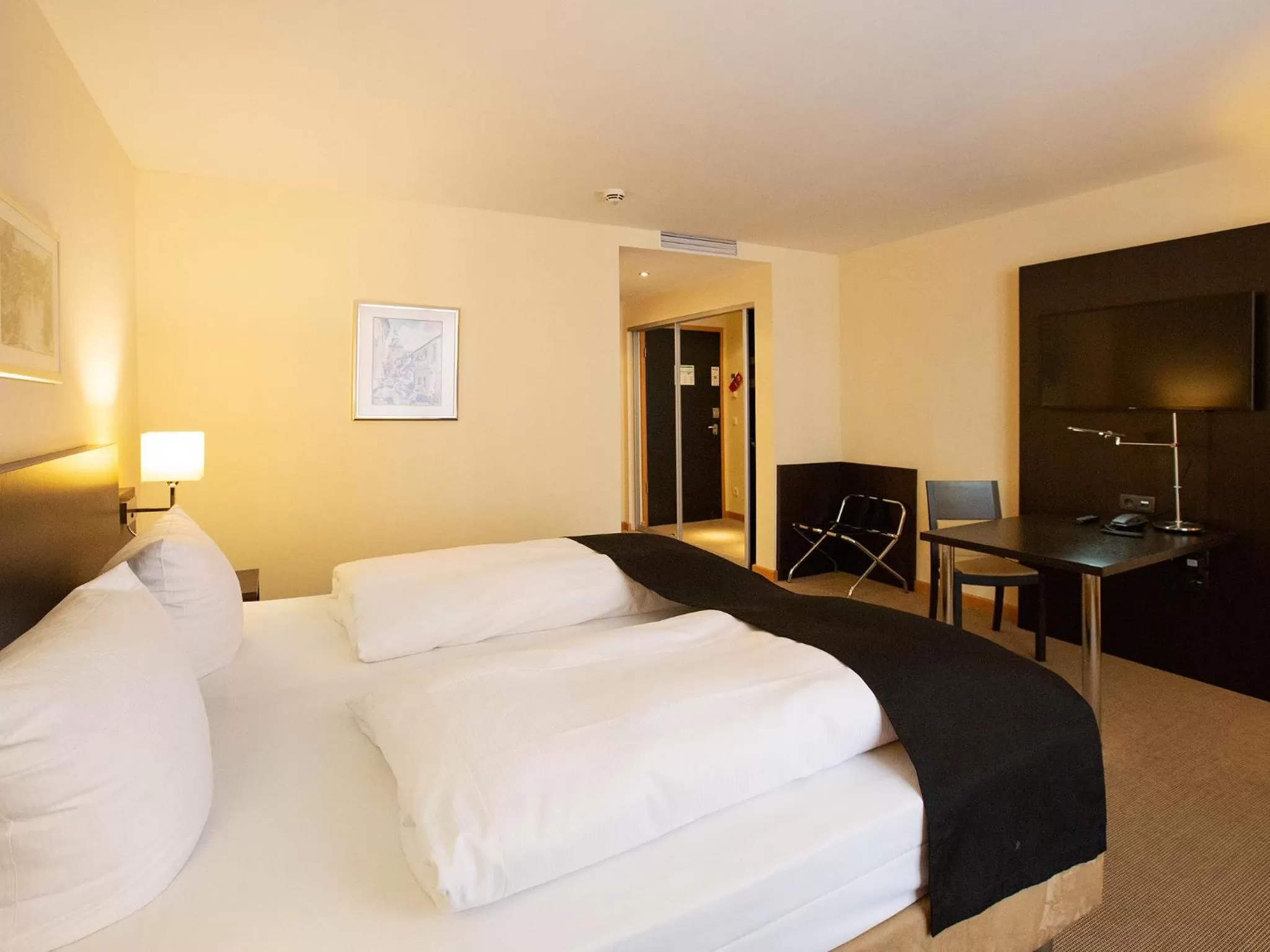 Photo of the whole room, Bed in DORMERO Hotel Altes Kaufhaus Lüneburg