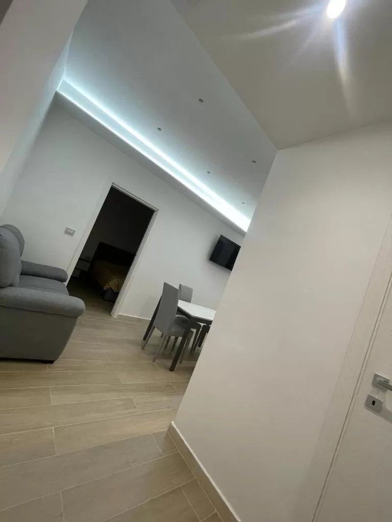 Communal lounge/ TV room in B&B MANFREDI