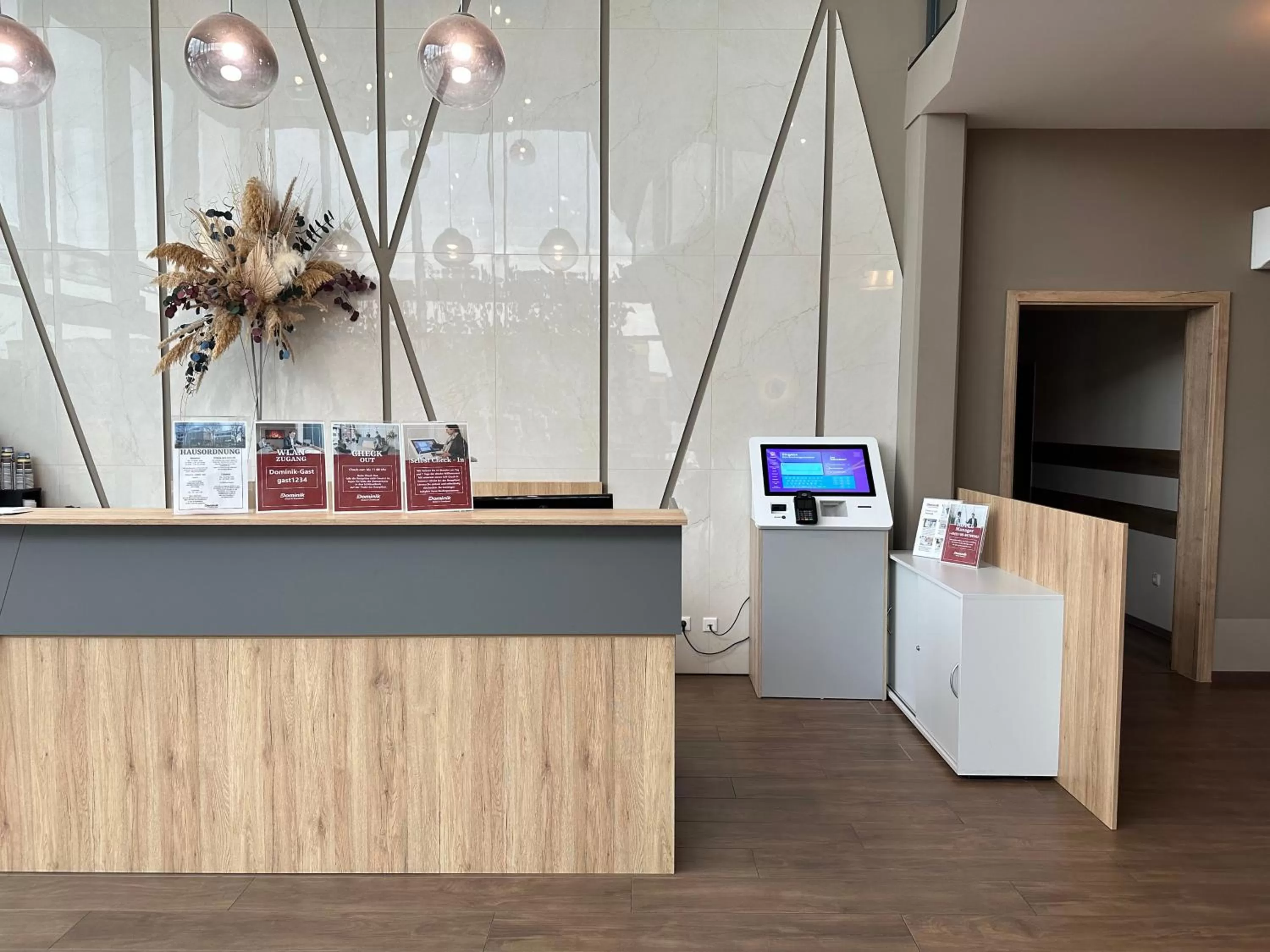 Lobby or reception in Dominik Hotel & Eventsaal
