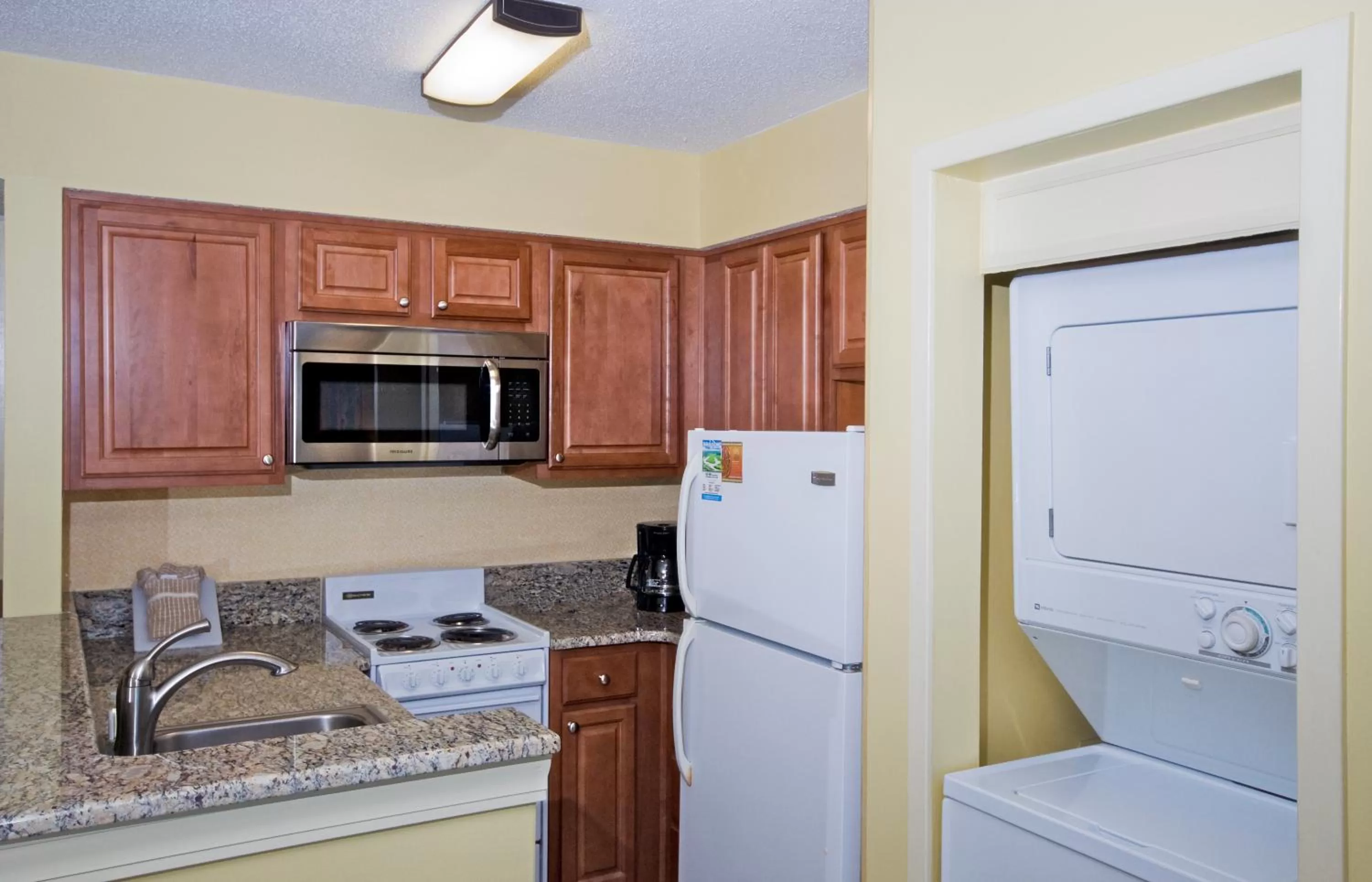 Kitchen or kitchenette in The Strand - A Boutique Resort