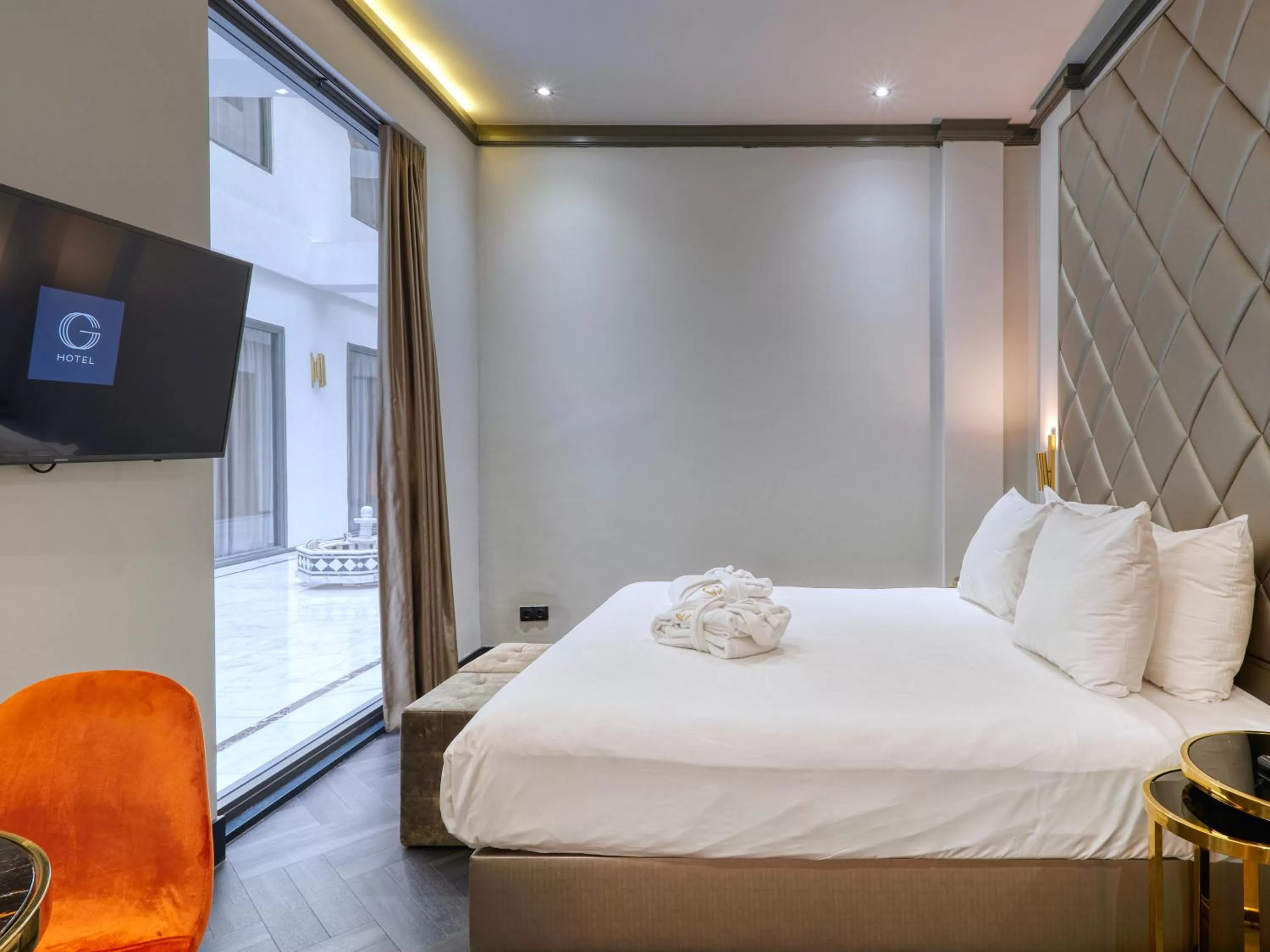 Bed in Triple G Hotels