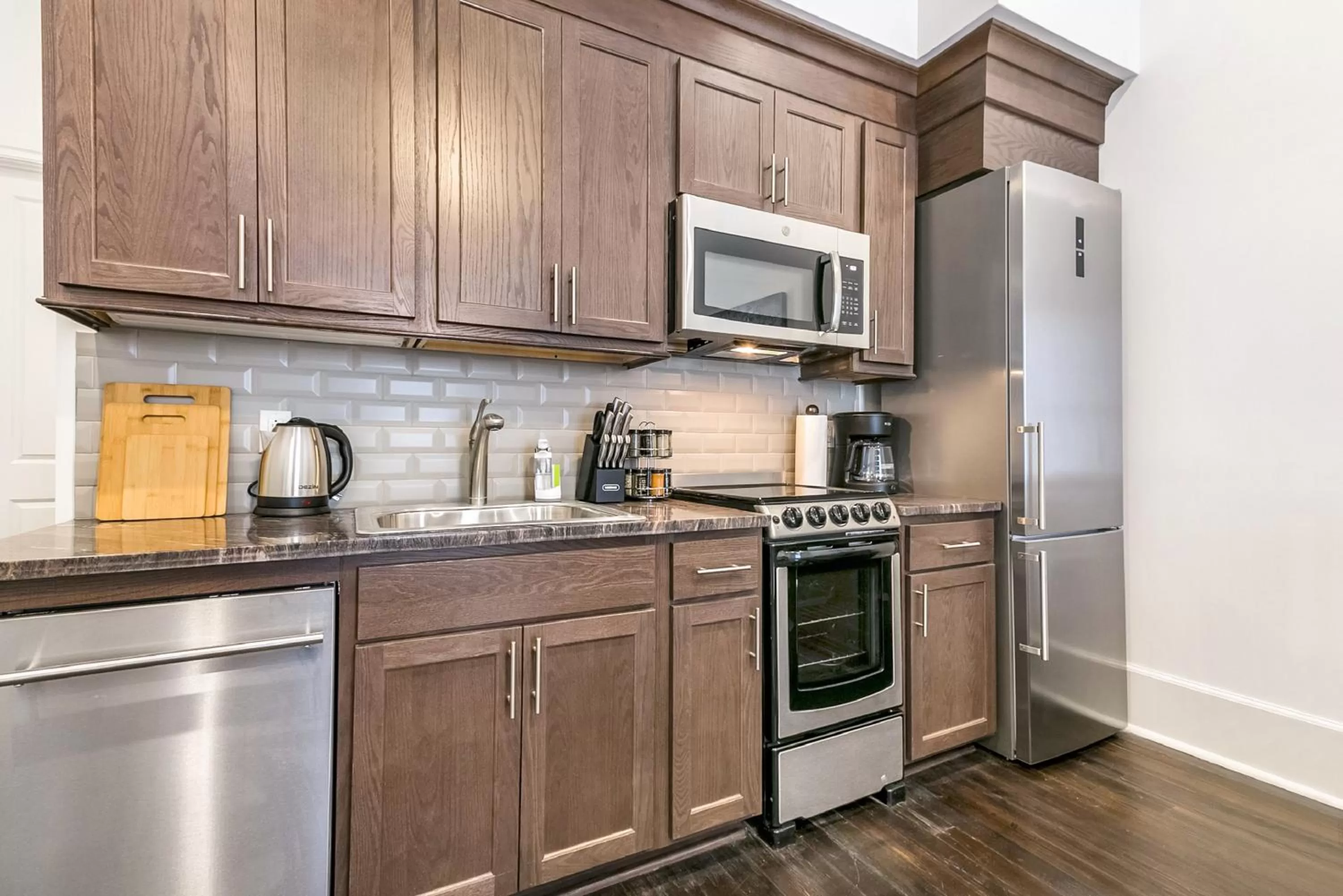 Kitchen or kitchenette in 1 and 2 BR Private Condos Steps Away From French Quarter