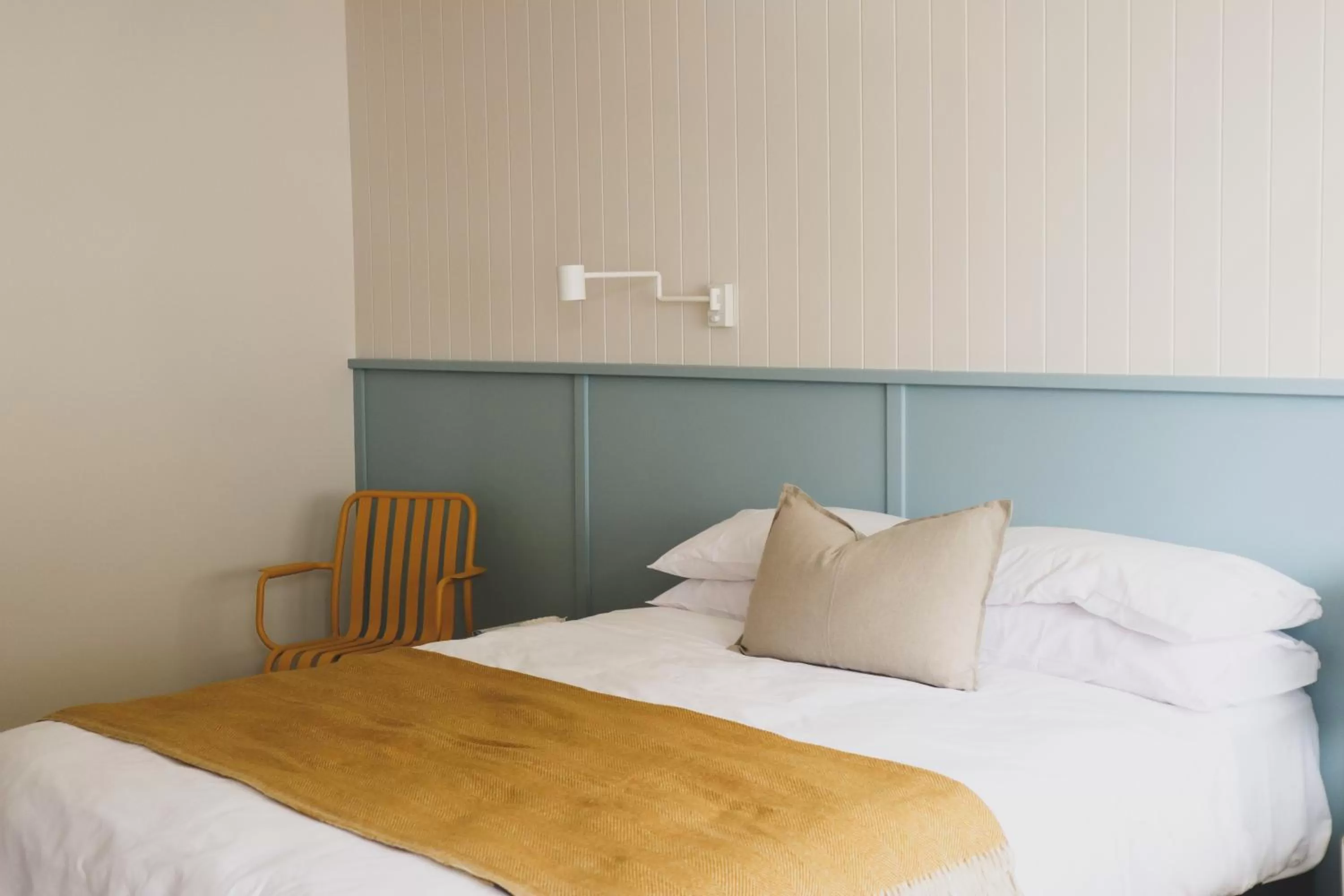 Bed in The Blue Water Motel