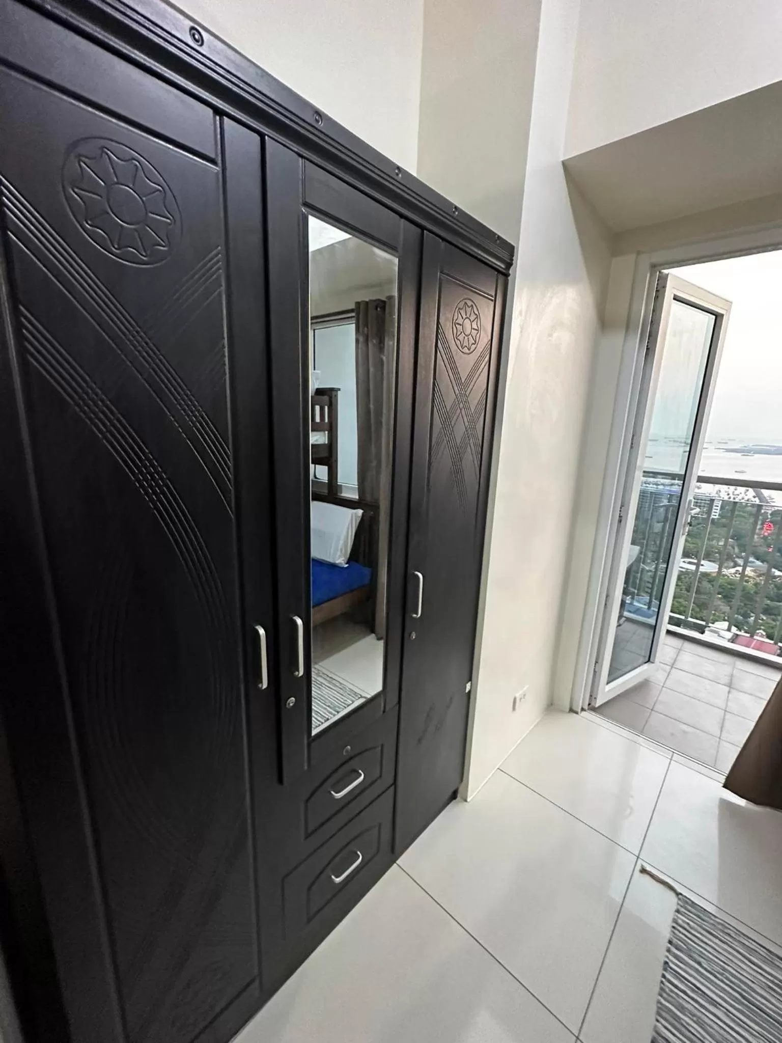 wardrobe in Green Residences Stays by PBYY