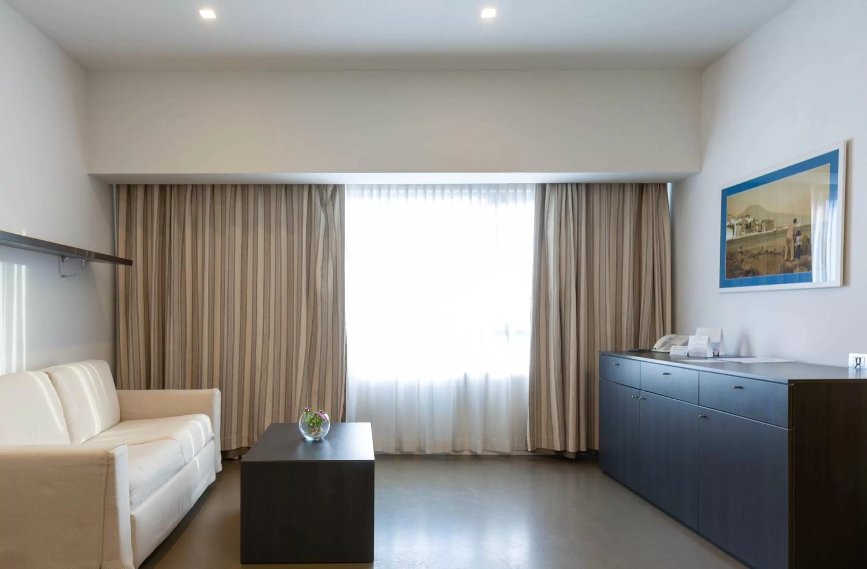 Living room, Bed in Hotel Poseidon