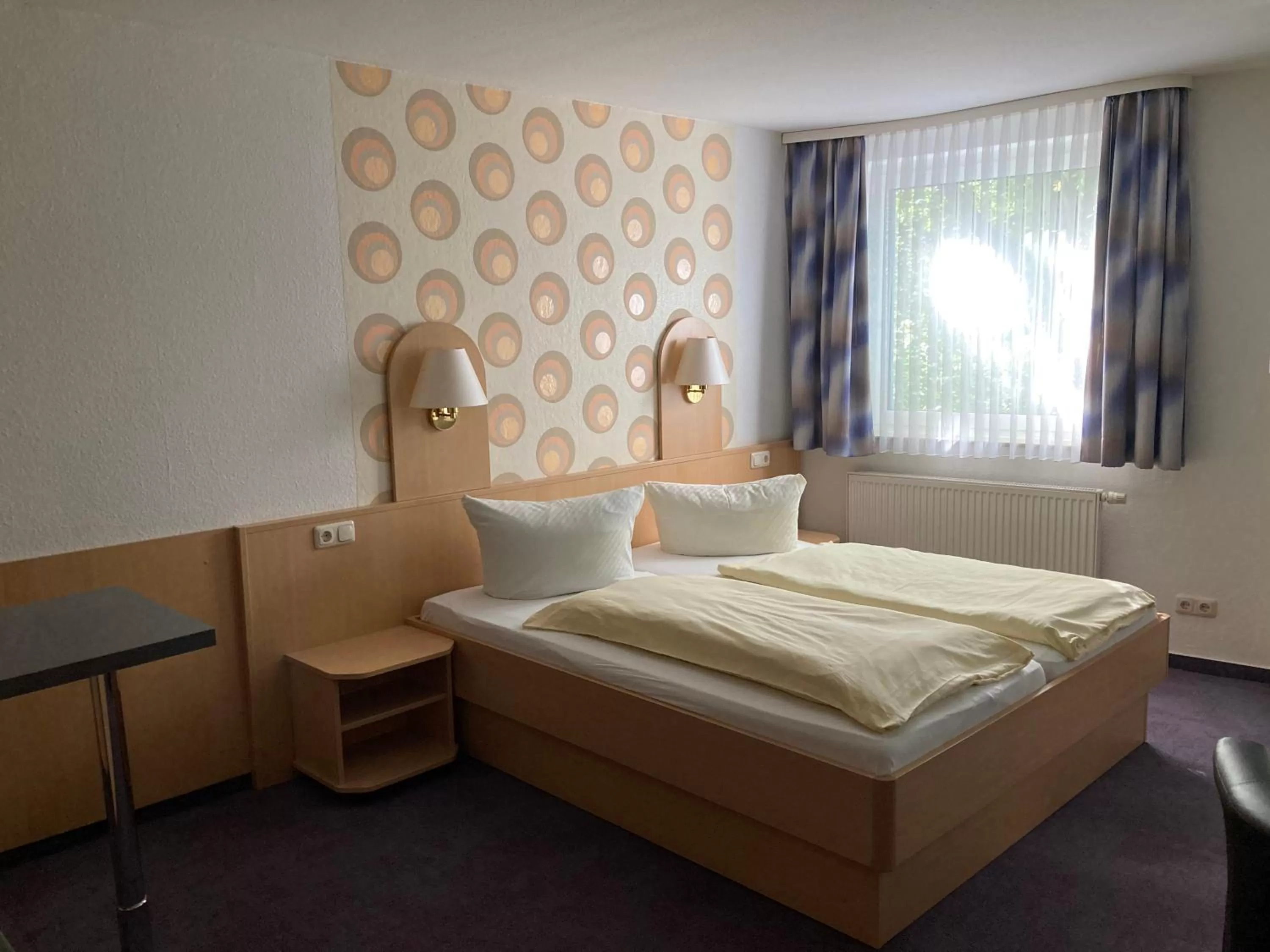 Bed in Zeitwohnen Wolfsburg, ehemals Hotel am Klieversberg ein Unternehmen der Micha'S Hotelbetriebe