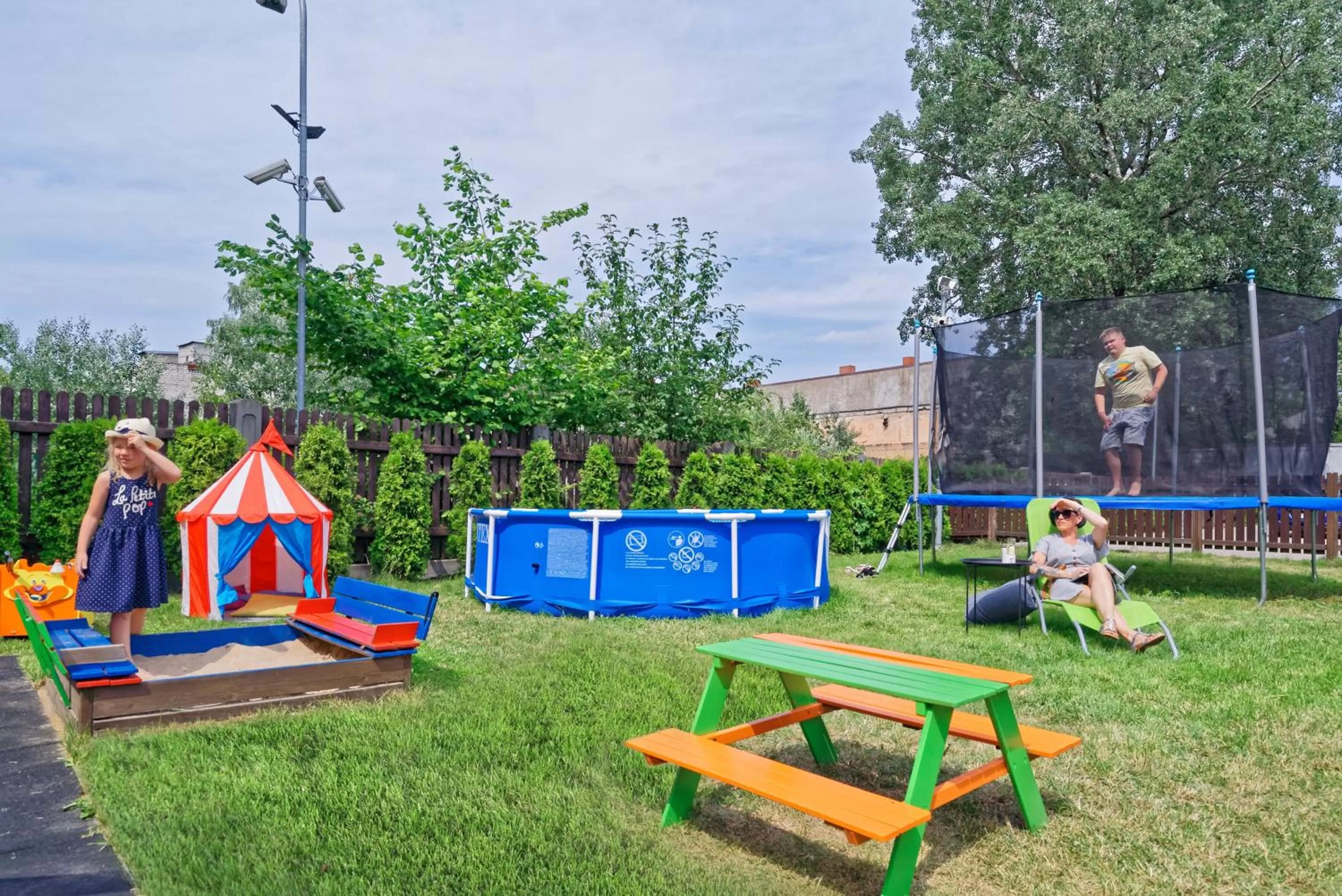 Children play ground in RIGAAPARTMENT SONADA Self-Service Aparthotel - Private Parking