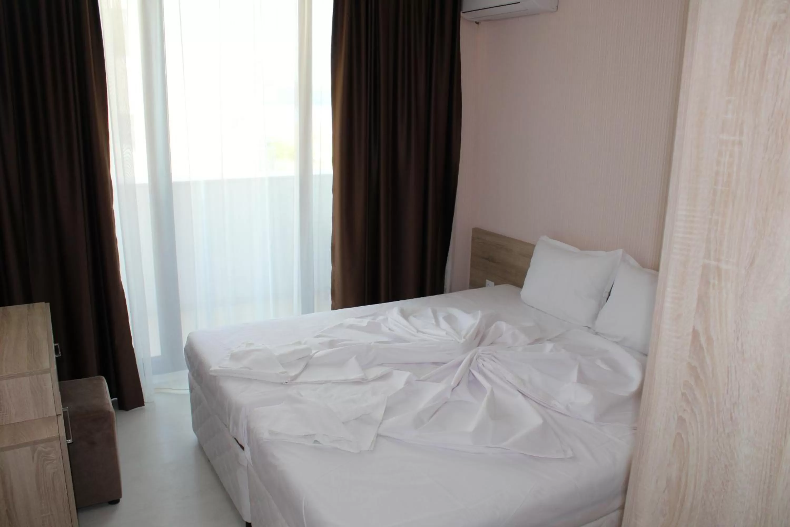 Bed in APART-HOTEL Stamopolu Lux с изглед към морето