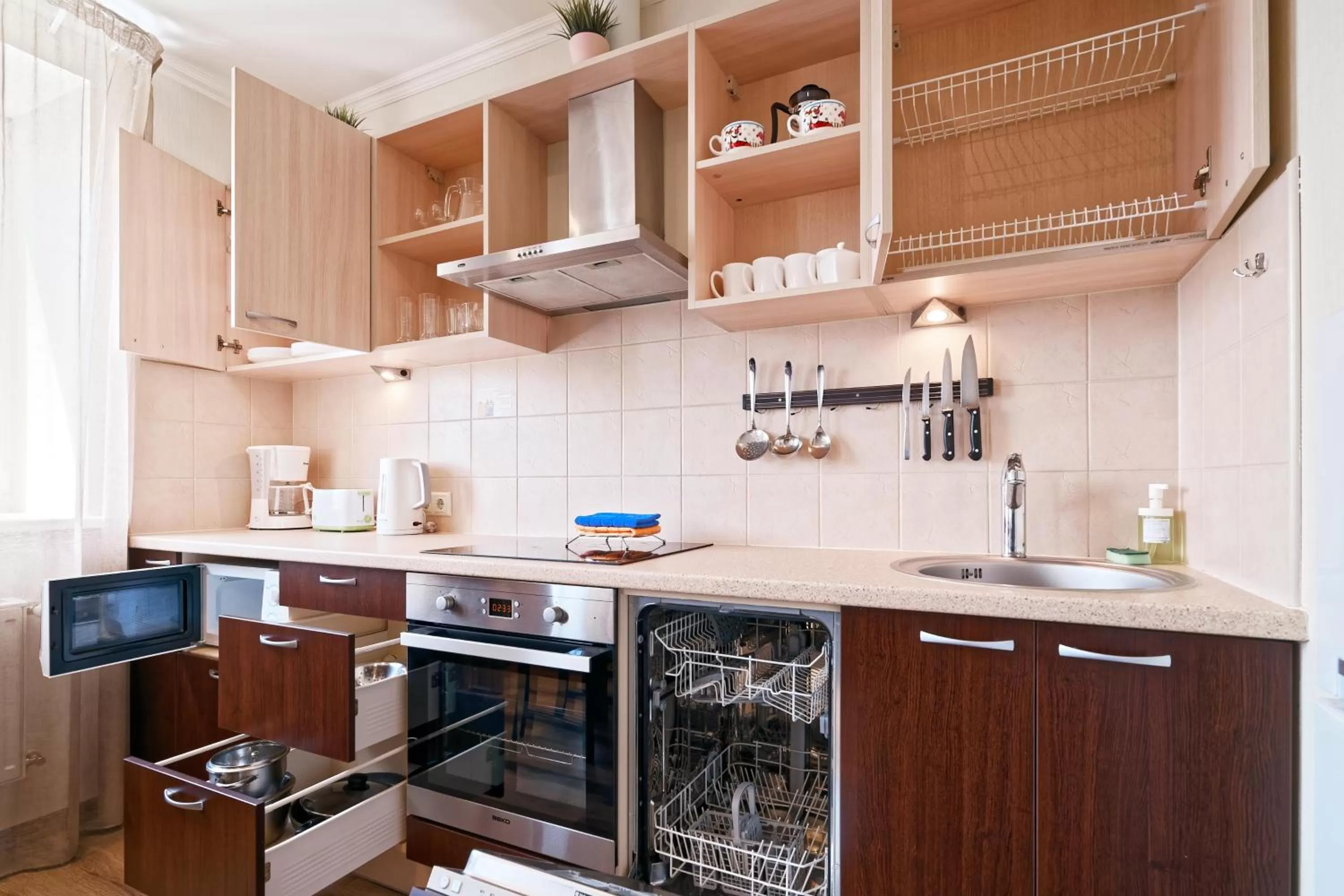 Kitchen or kitchenette in RIGAAPARTMENT SONADA Self-Service Aparthotel - Private Parking