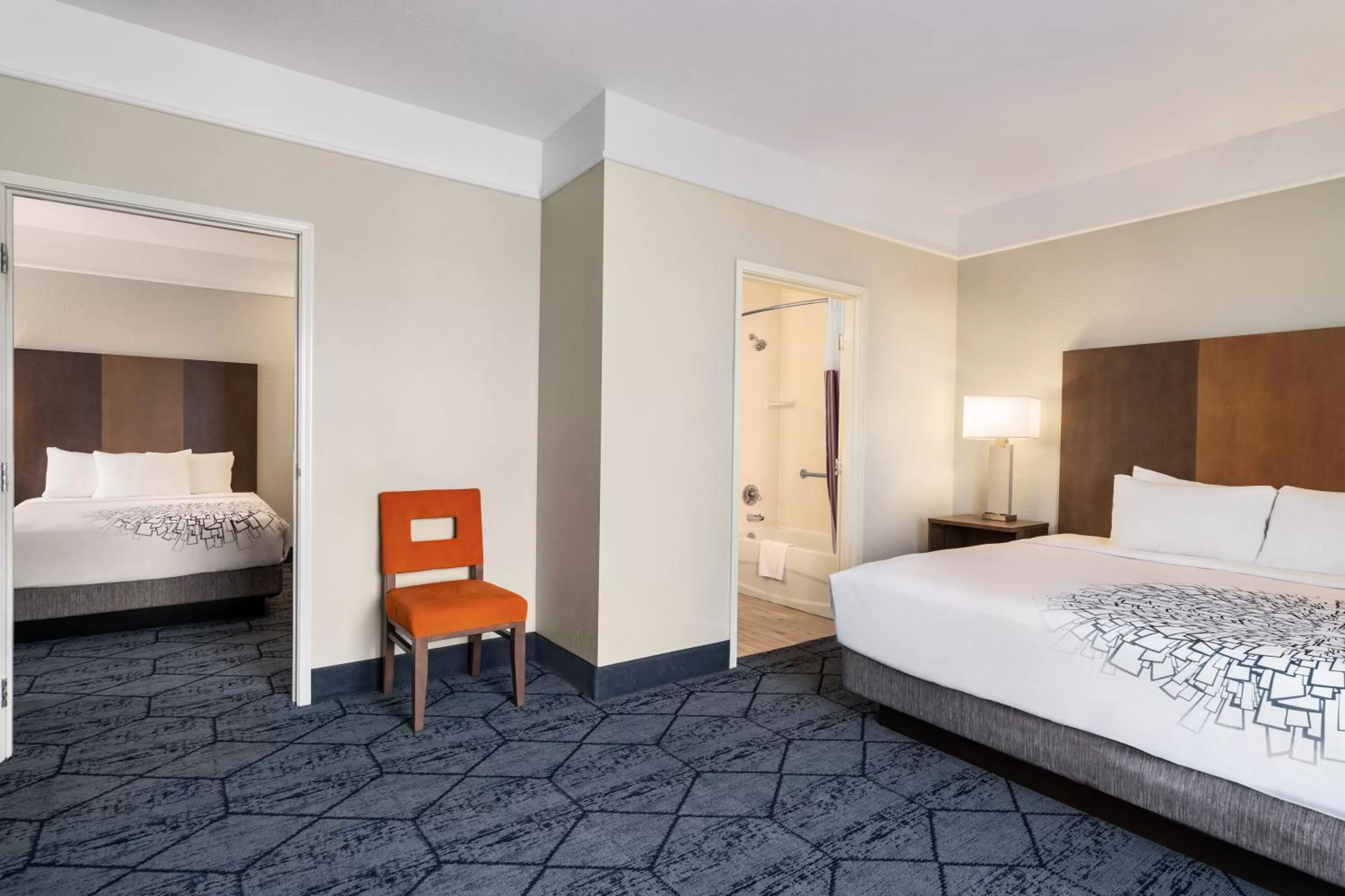 Bed in La Quinta Inn and Suites by Wyndham at WaTiki Waterpark