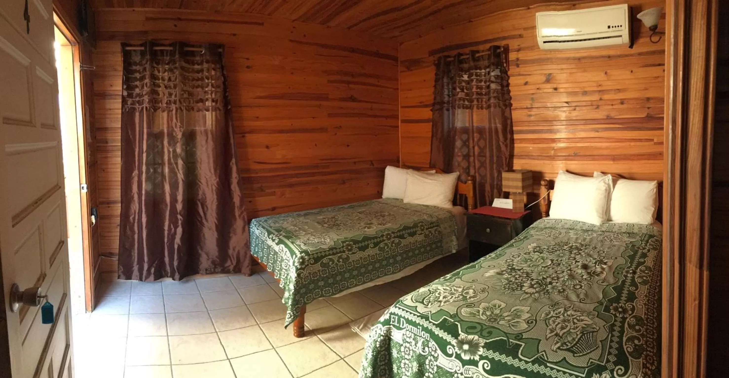 Bed in Blue Wave Guest House