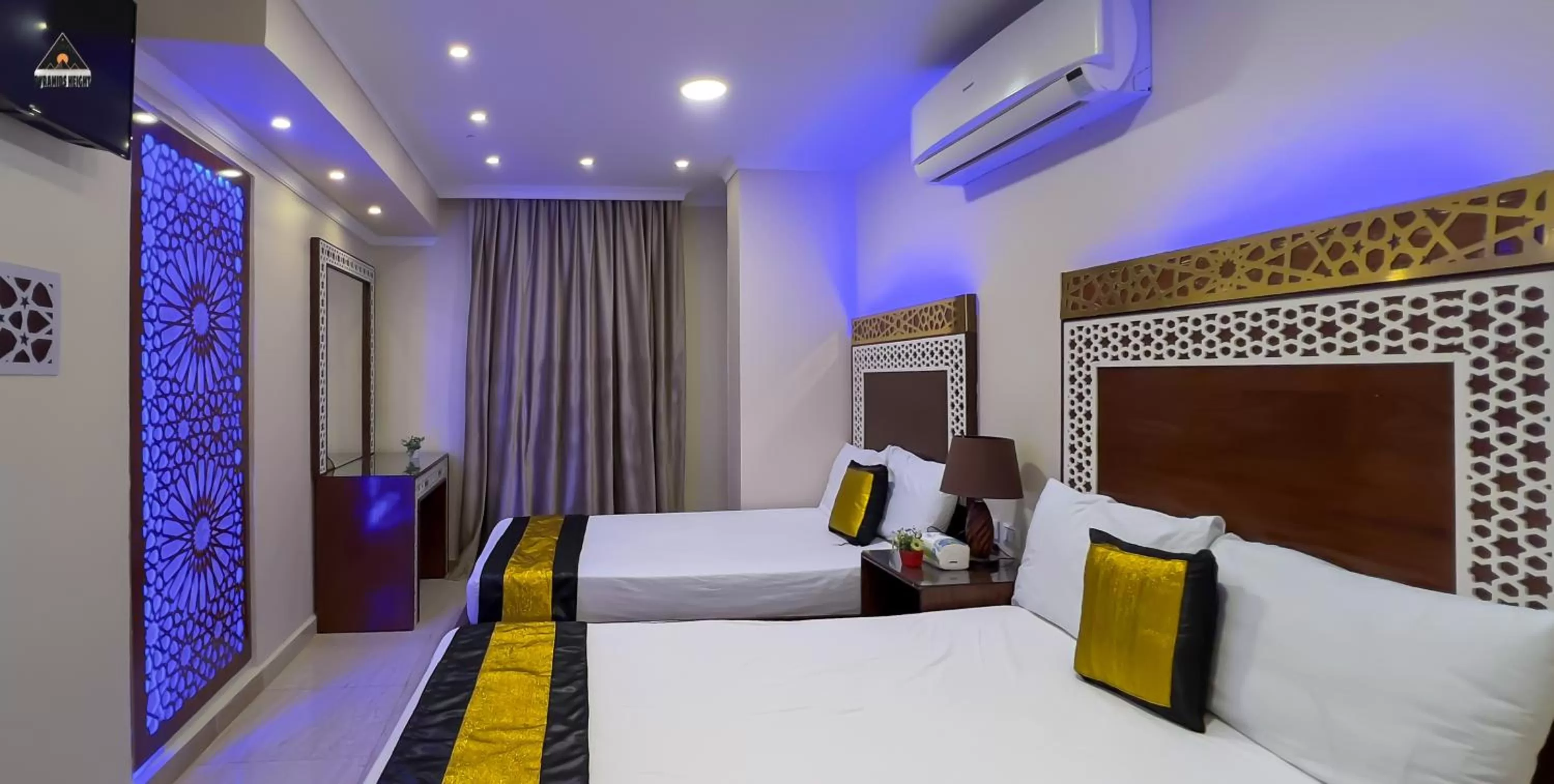 Bed in Pyramids Height Hotel & Pyramids Master Scene Rooftop