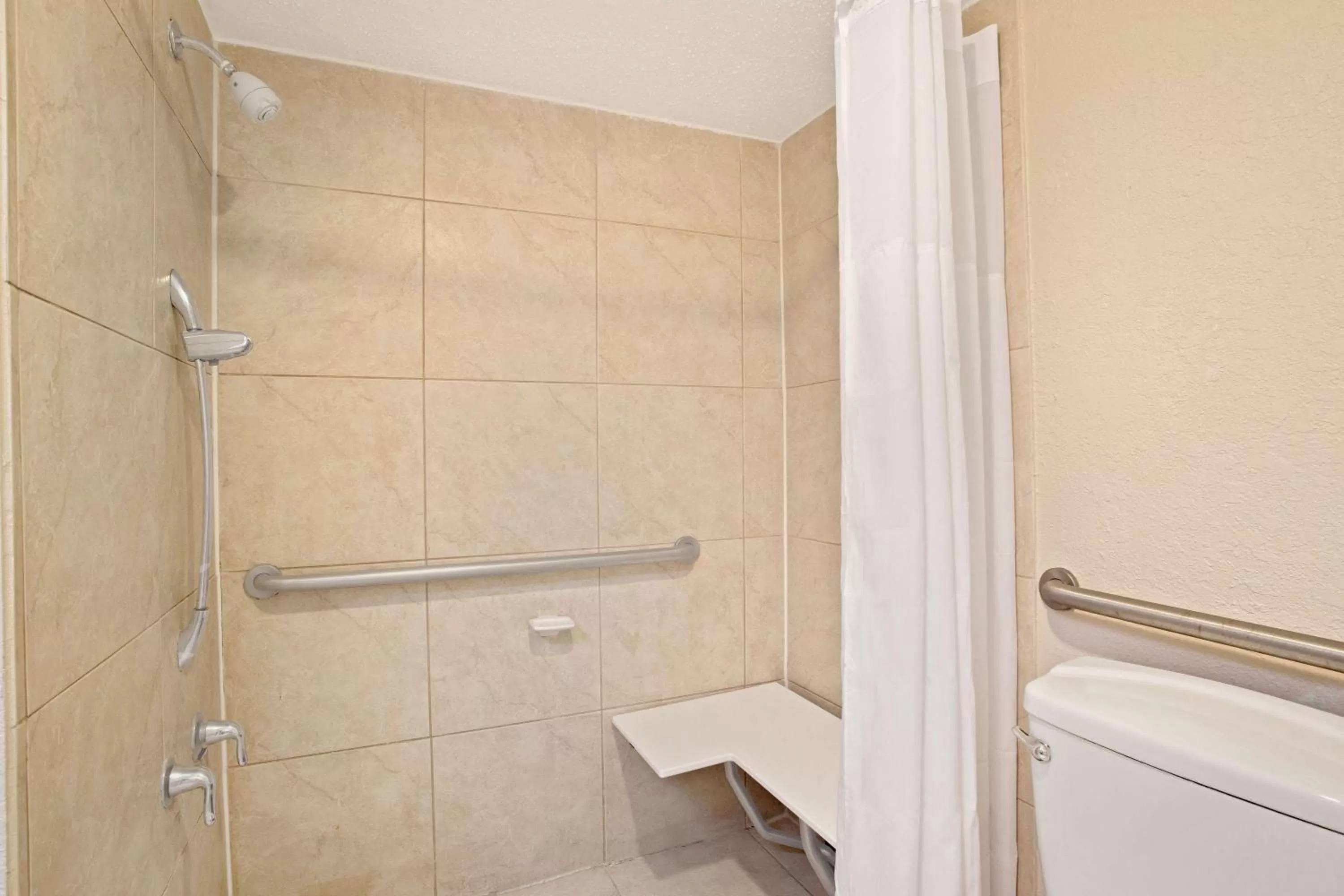 Bathroom in Days Inn by Wyndham Orlando Airport Florida Mall