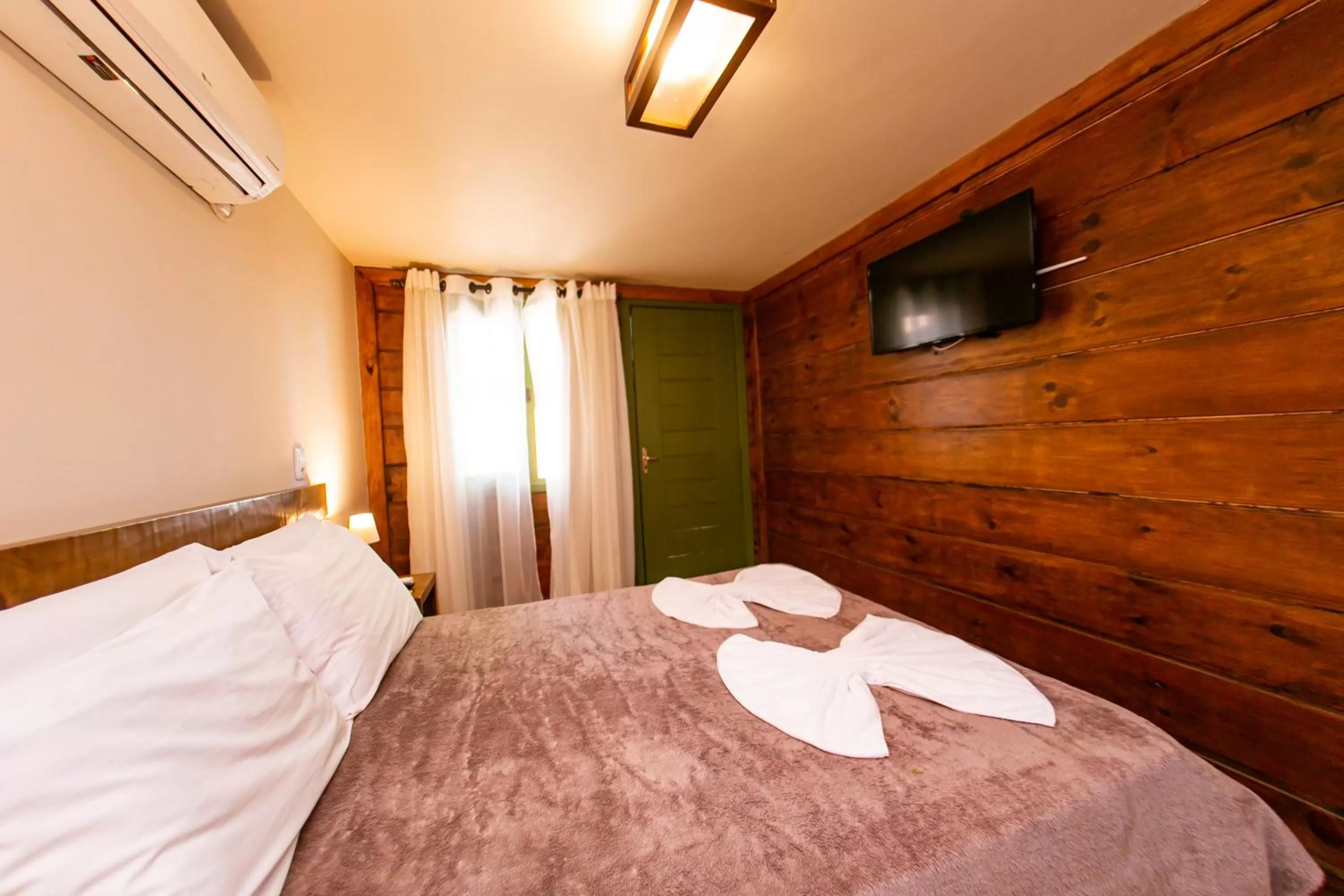 Bed in Pousada Charm Canela