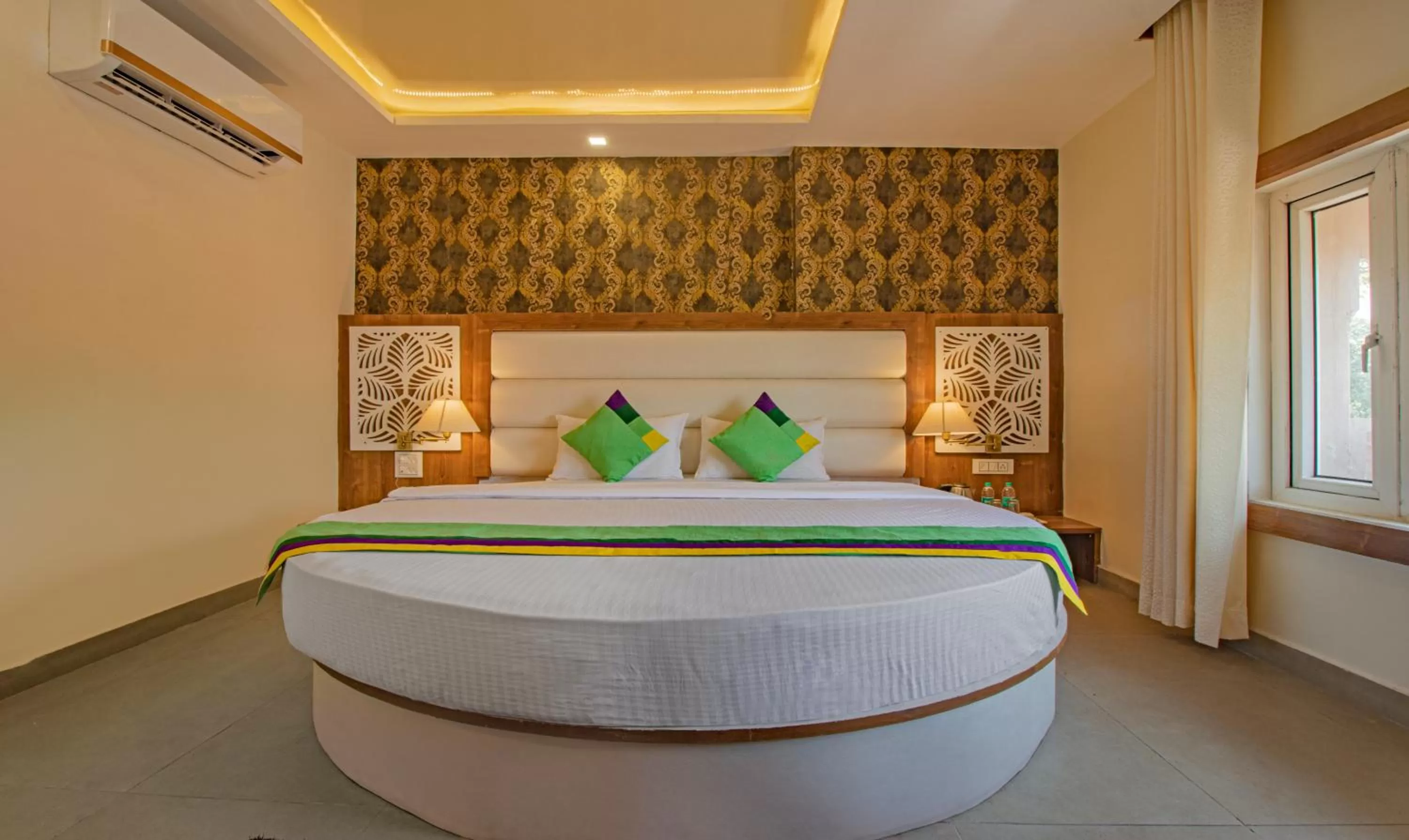 Bed in Treebo Trend Haveli Resort Roots Bhupatwala