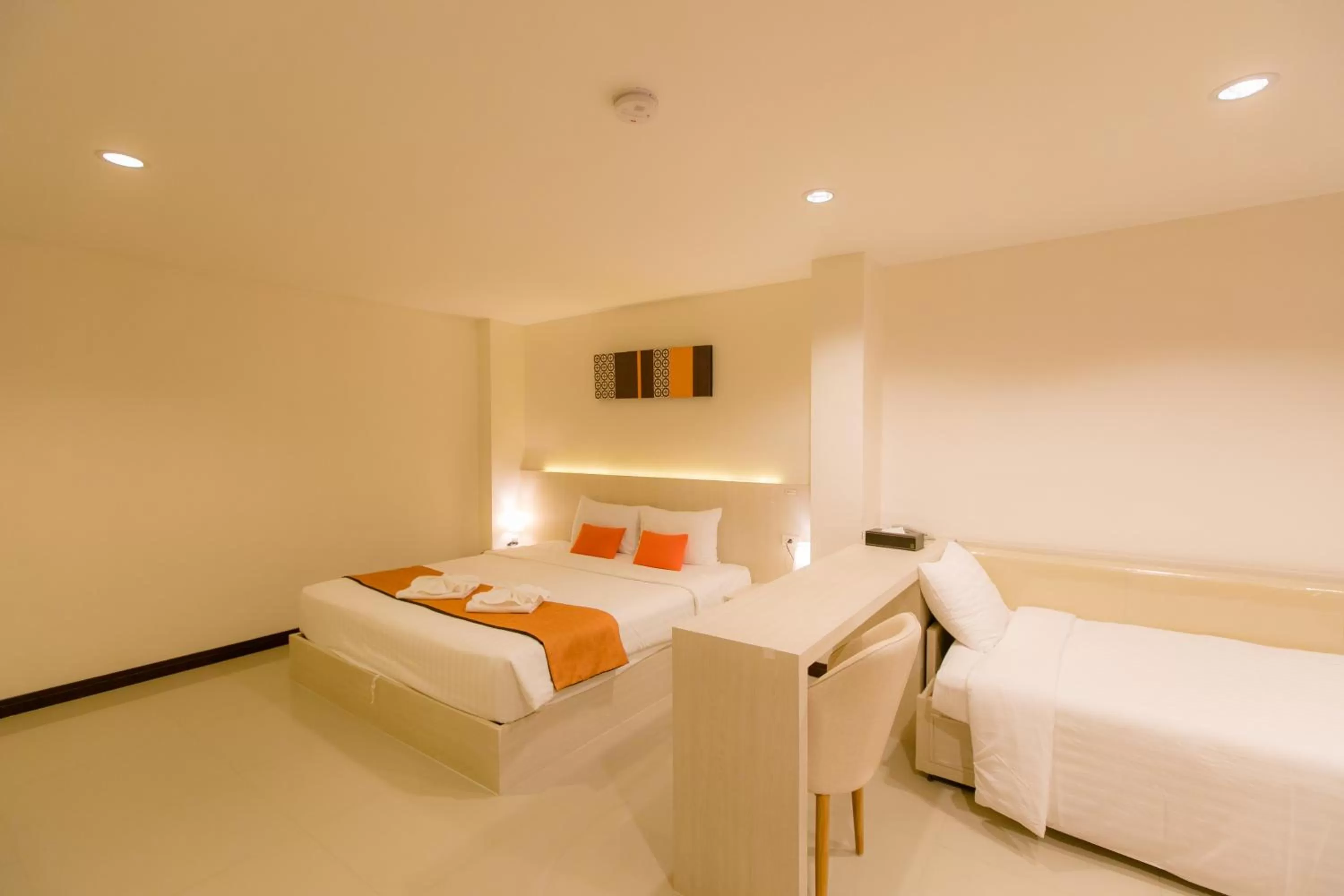 Bed in De Hug Hotel & Residence