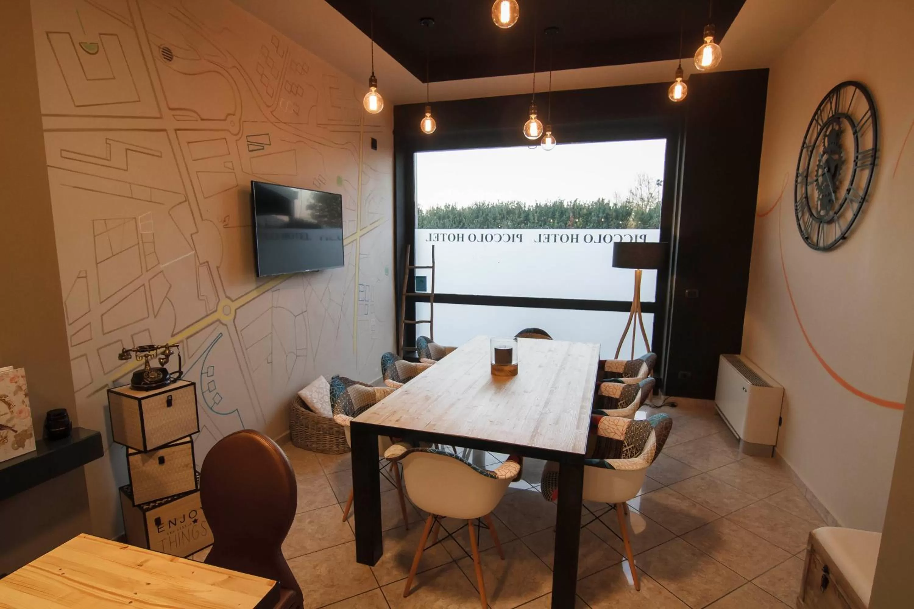 Communal lounge/ TV room in Piccolo Hotel Allamano