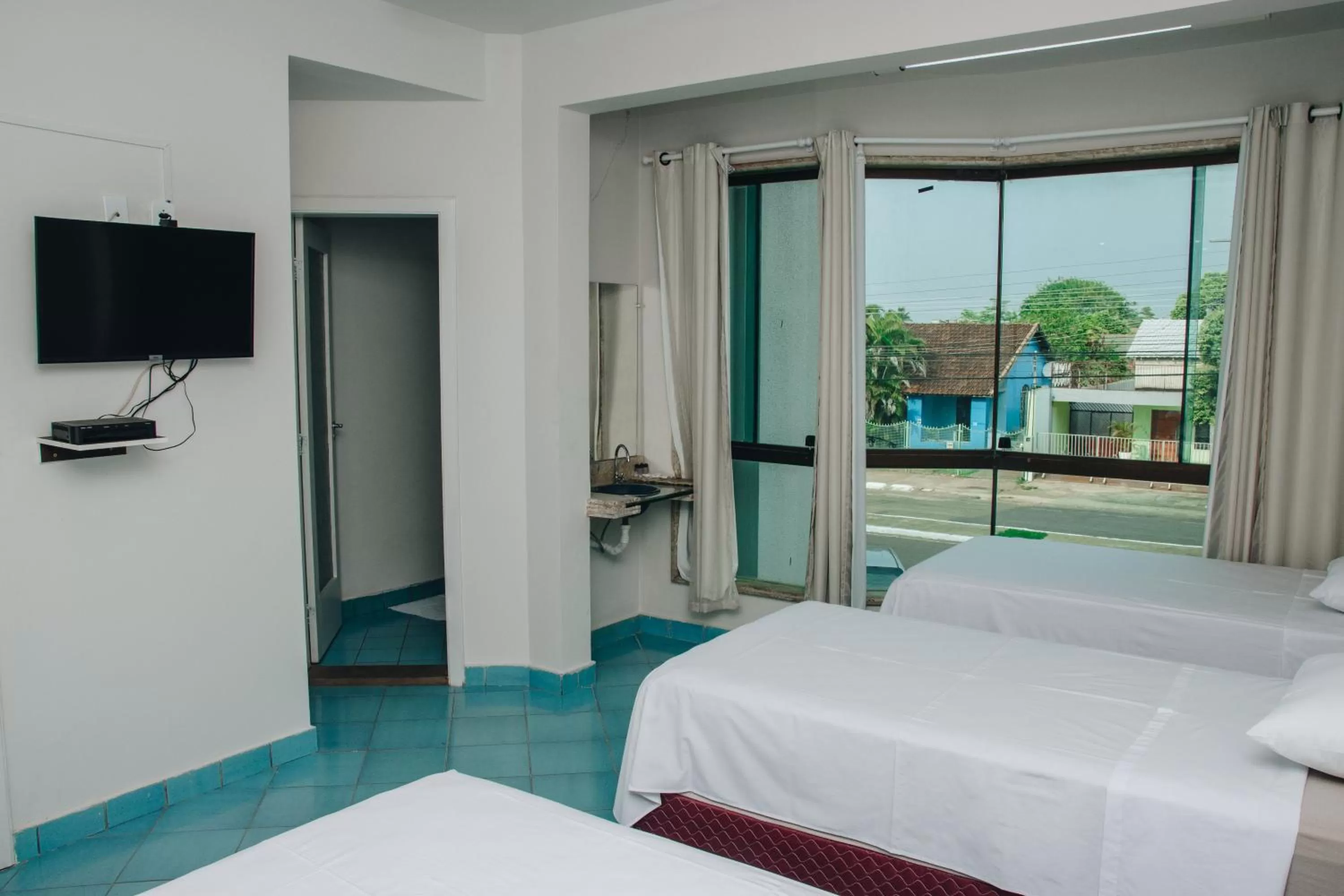 Bed in SAMIR HOTEL COMFORT