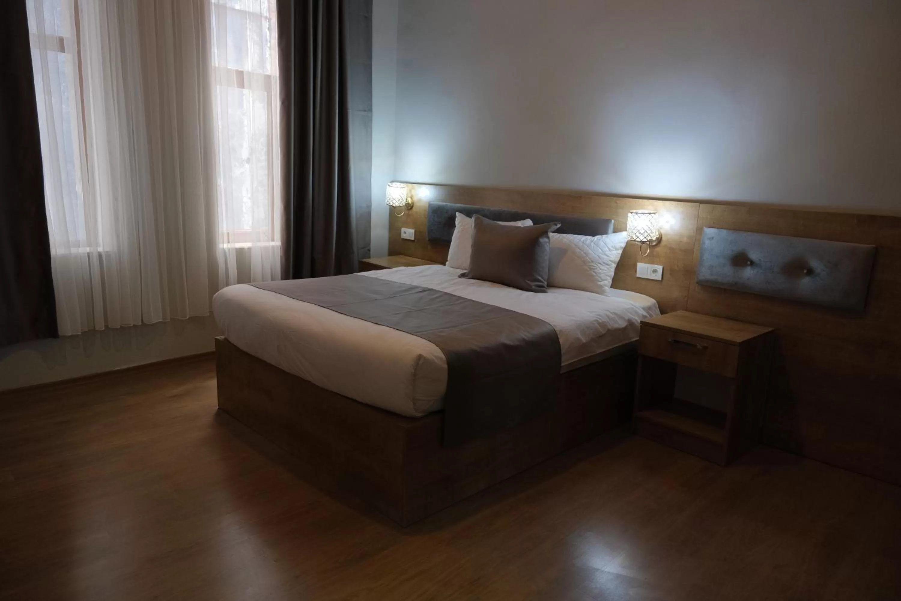 Bed in Adamantides Hotel