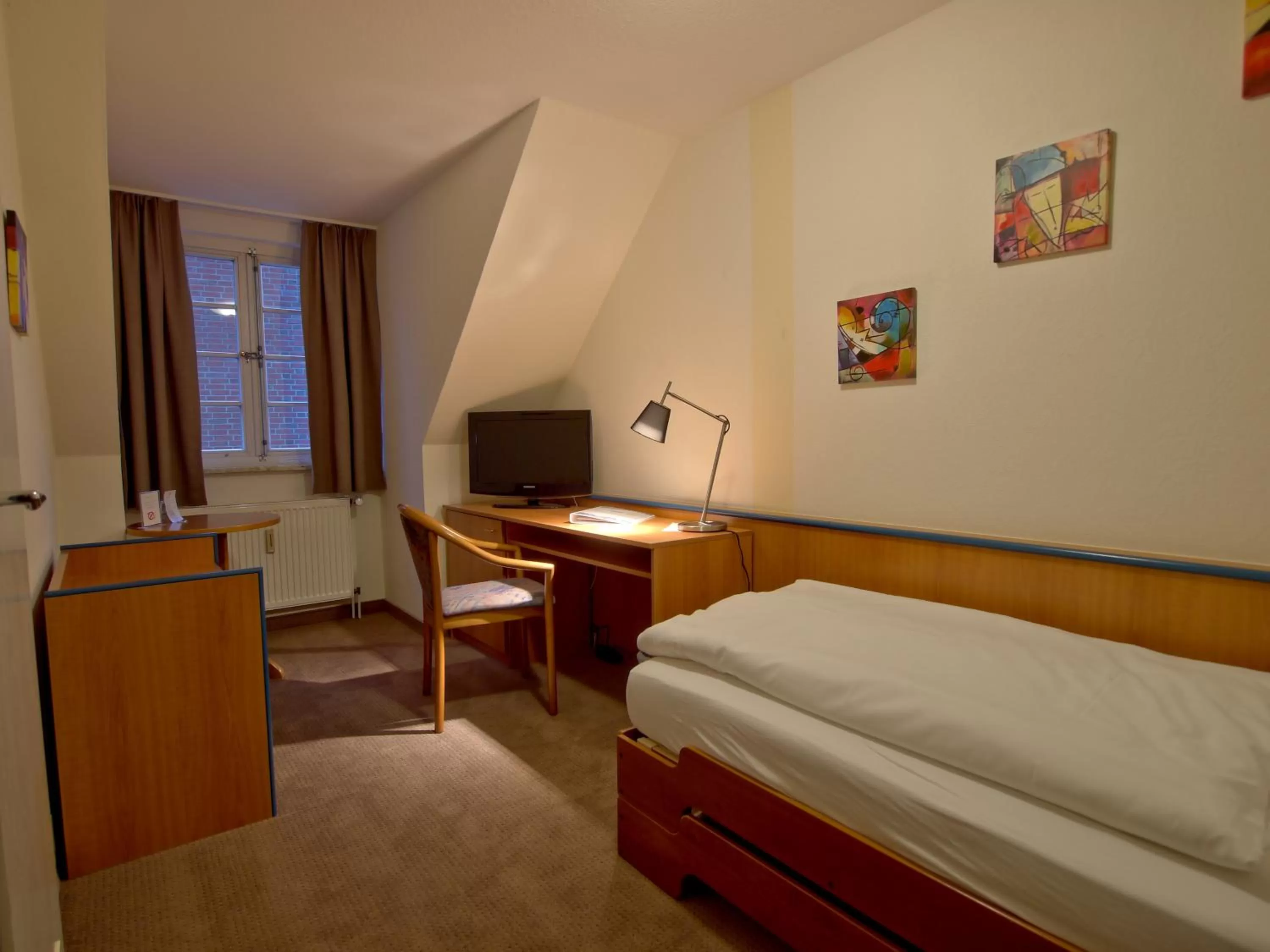 Bed in Hotel Friesische Wehde