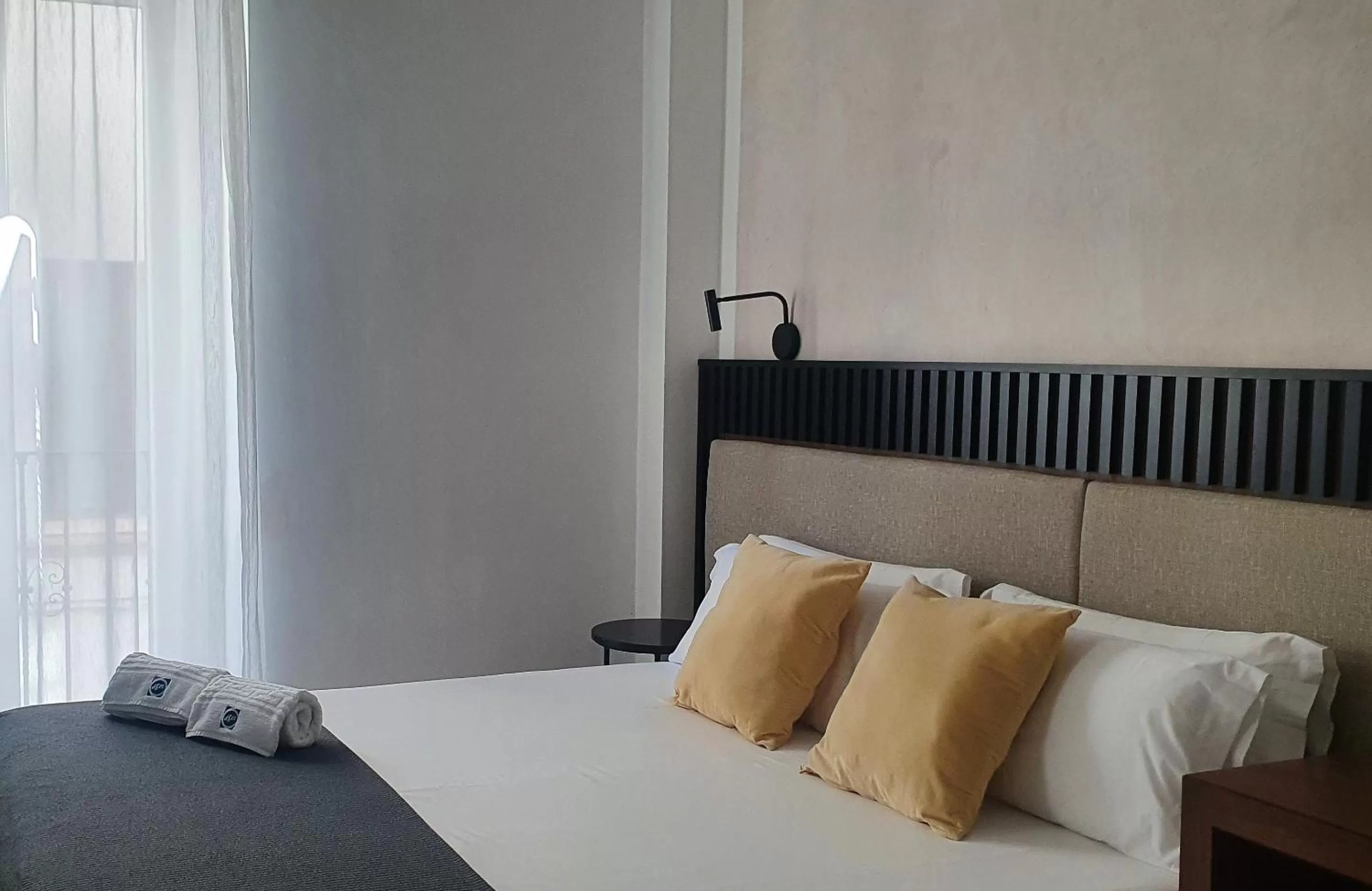 Bed in ISA Sevilla Suites