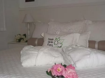 Bed in Pousada Vale Dos Figos