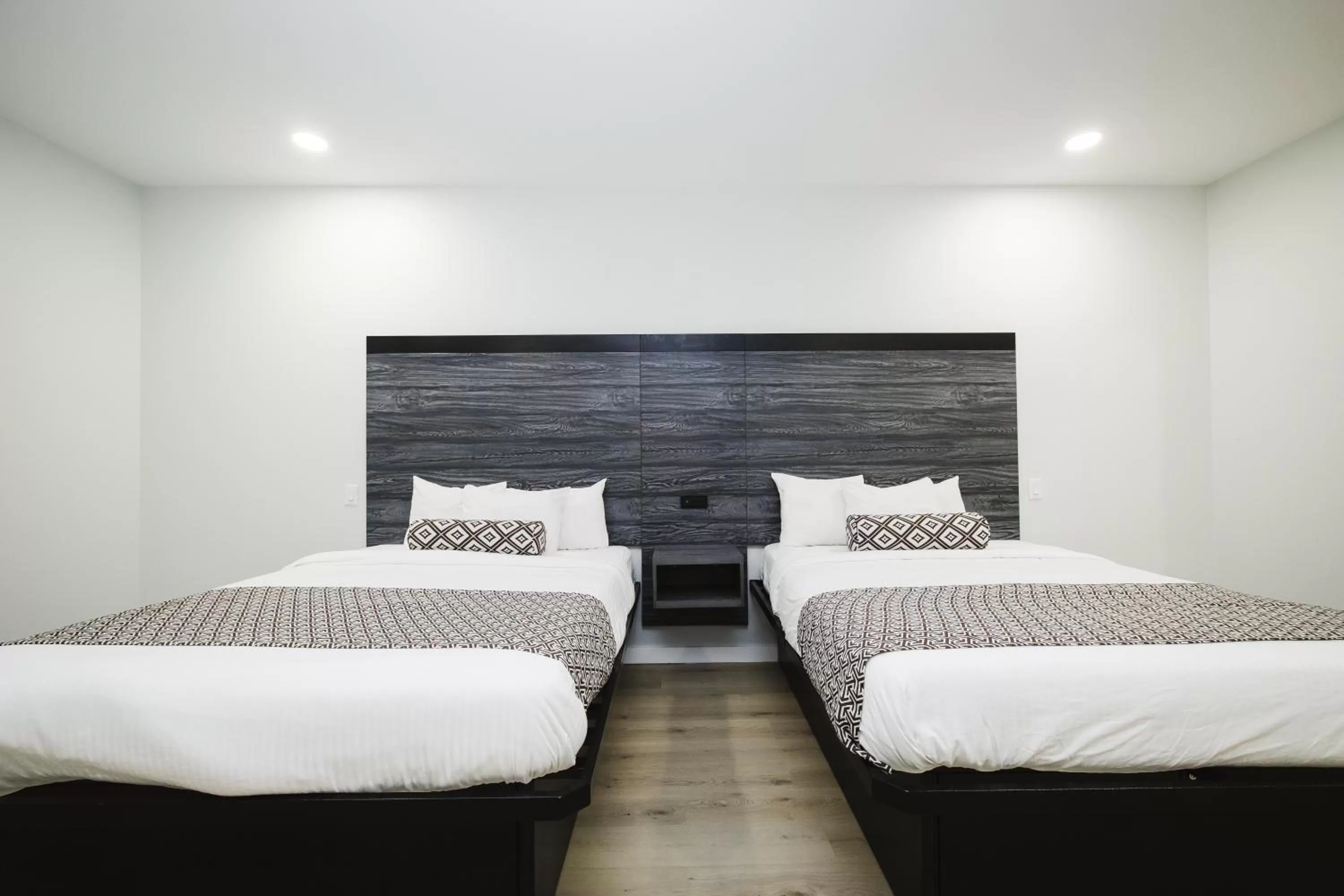 Bed in Sapphire Inn & Suites