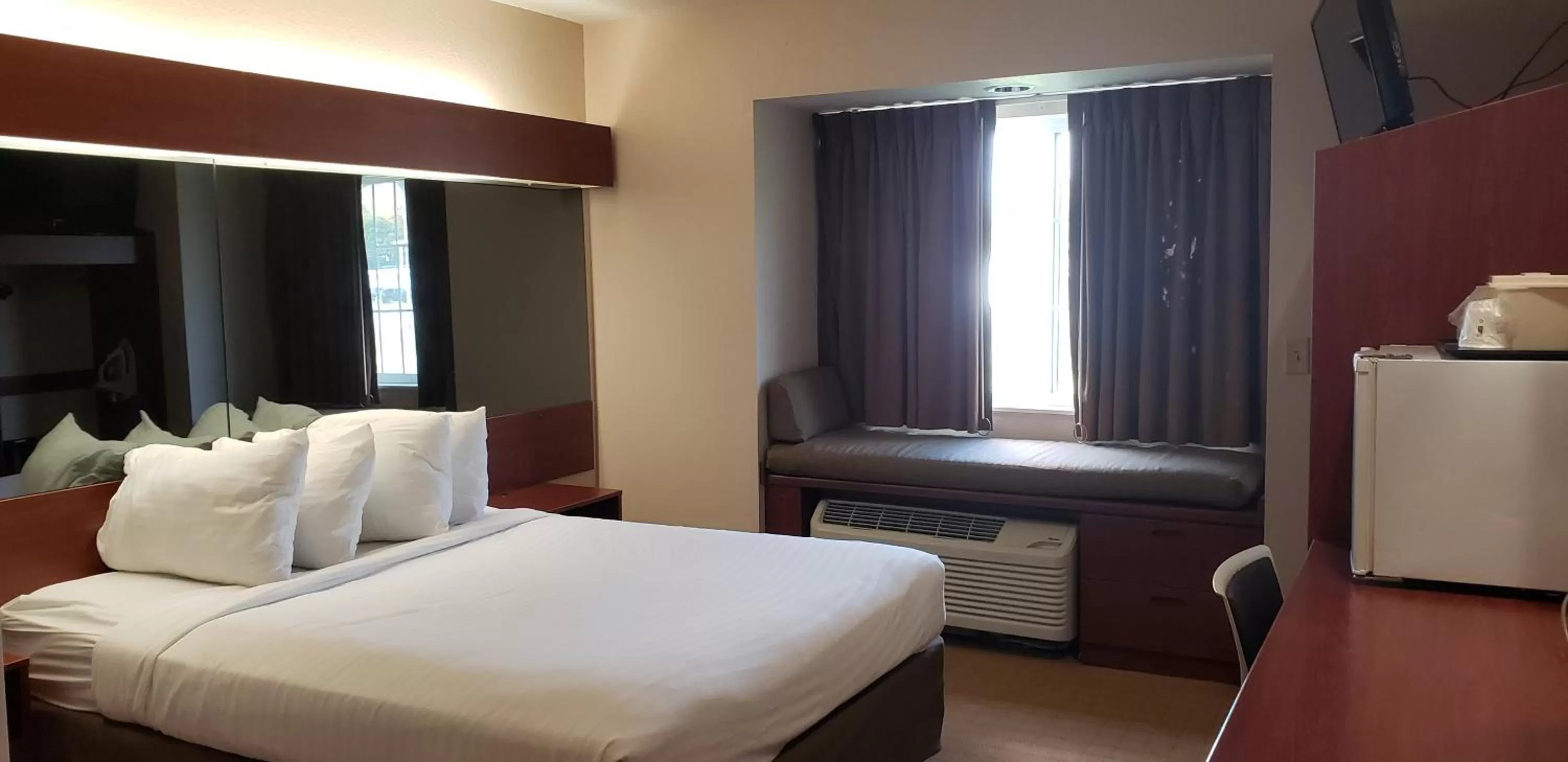 Bed in Microtel Inn & Suites by Wyndham Wellsville