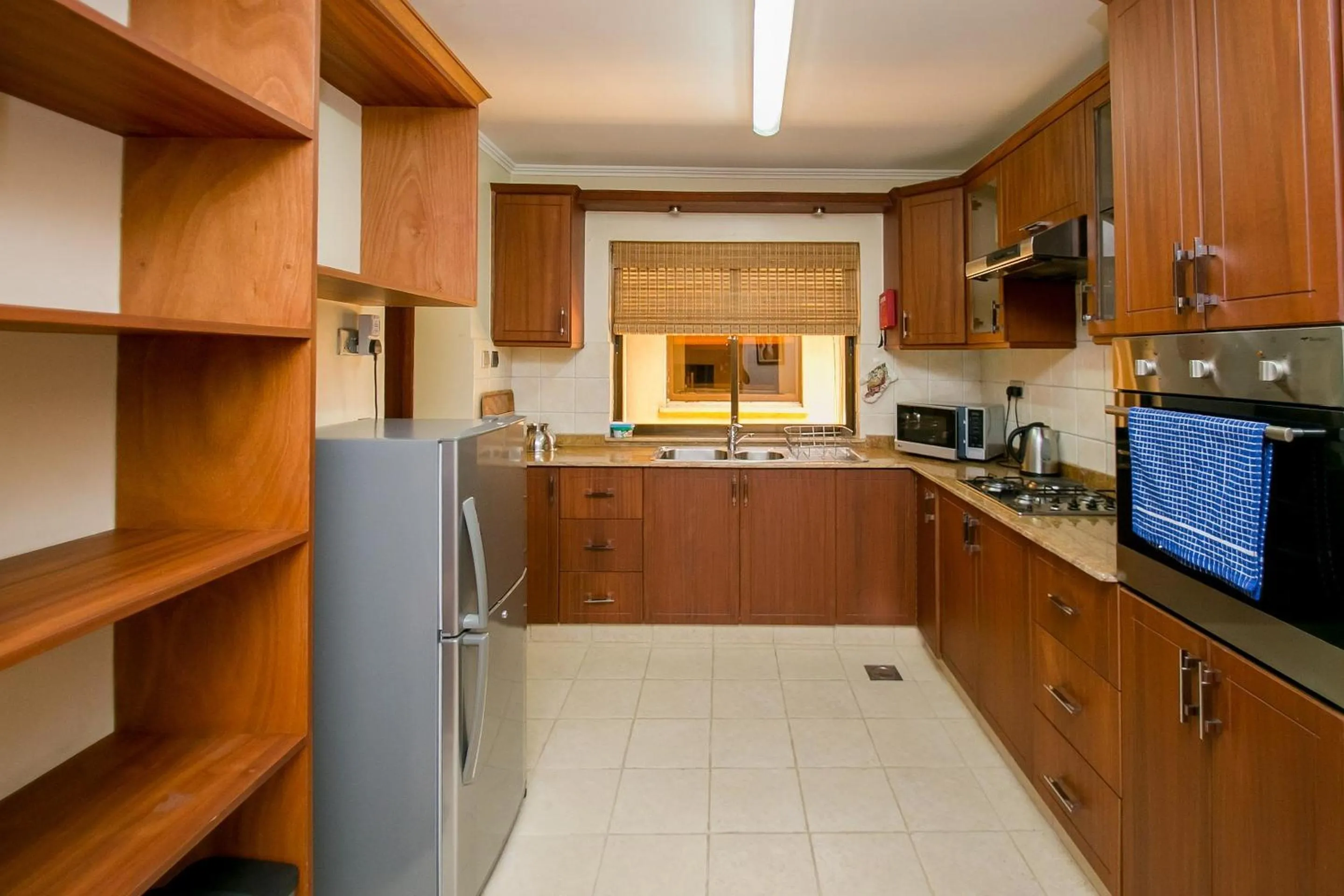Kitchen or kitchenette in Waridi Paradise Hotel and Suites