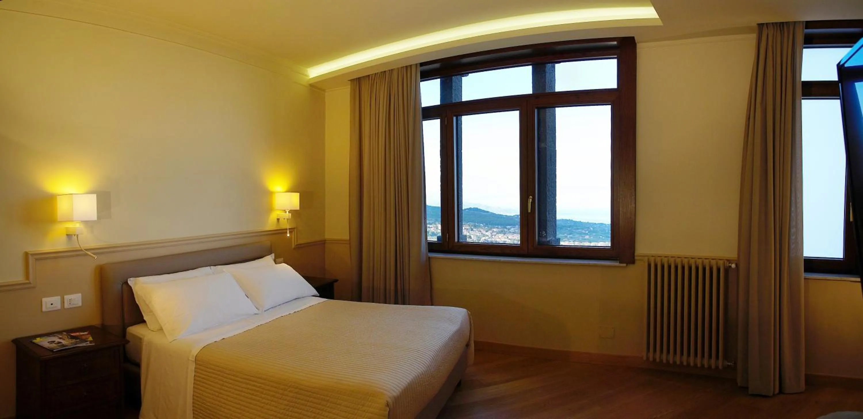 Bed in Airone Wellness Hotel